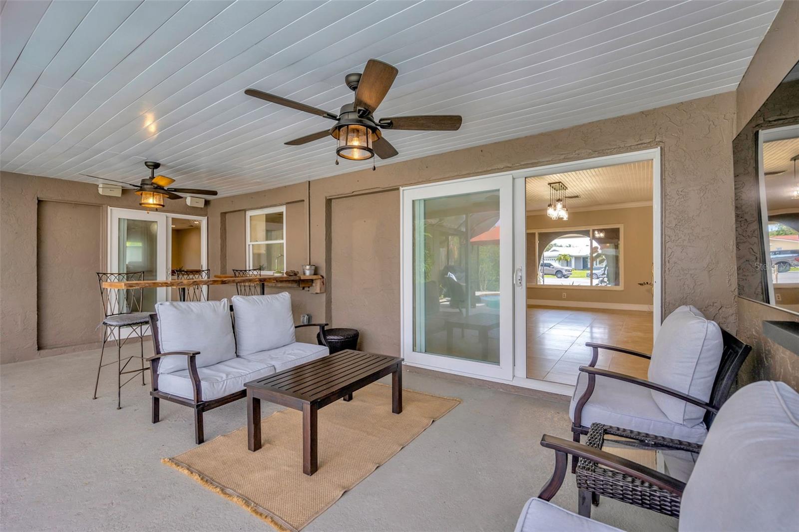 This cozy flex space may be too small to qualify as a bedroom, but it’s packed with potential! Whether you need a quiet home office, a fun playroom, or the ultimate pet retreat, this room delivers. Featuring a built-in pet door that leads directly to a fully fenced and covered outdoor area, it’s ideal for your furry (or even piggy!) friends to enjoy safe, shaded playtime. Compact in size, but big on possibilities!