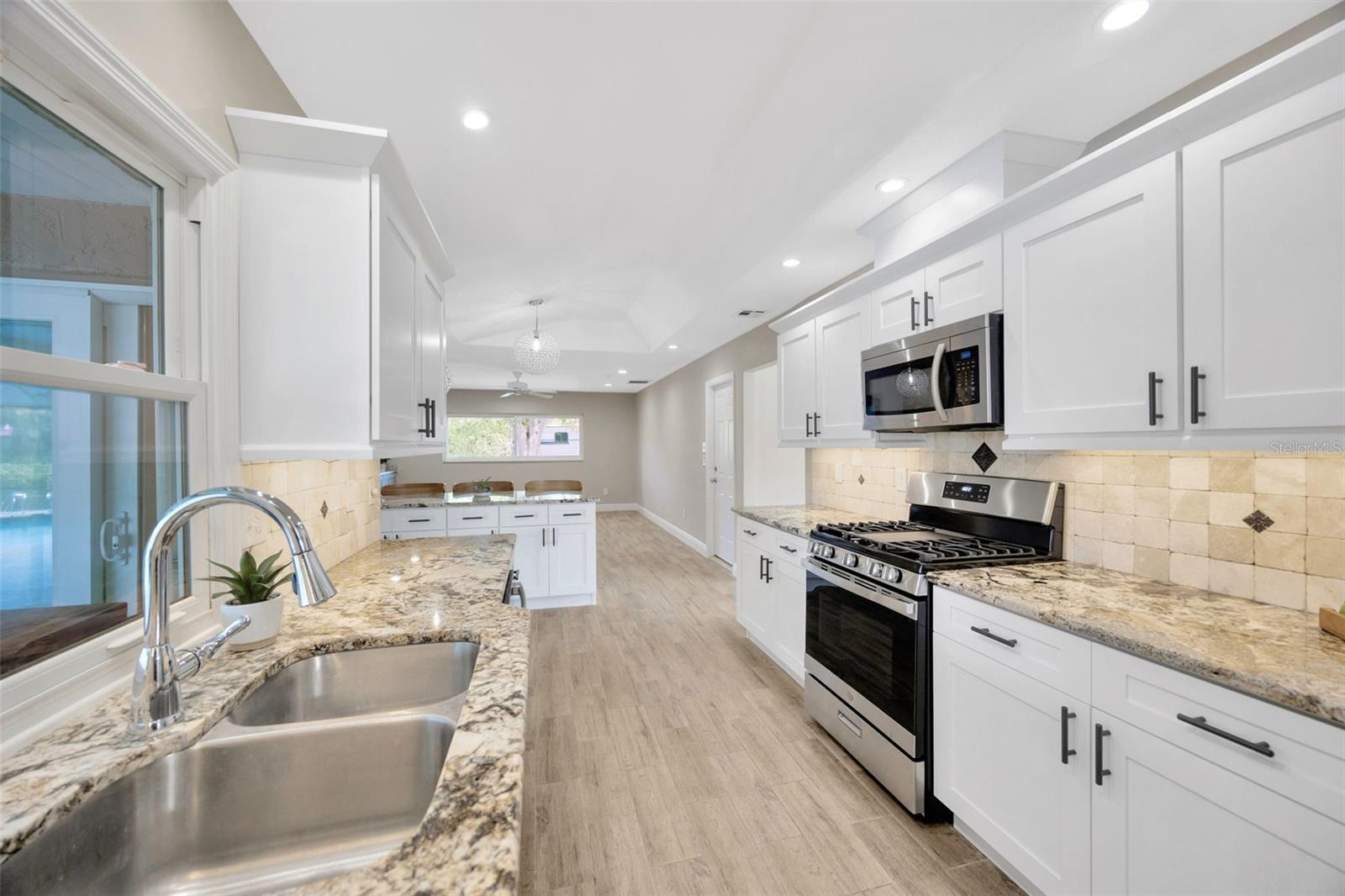 Sink overlooks the pool and yard. Great for entertaining or just enjoying the peacefulness.