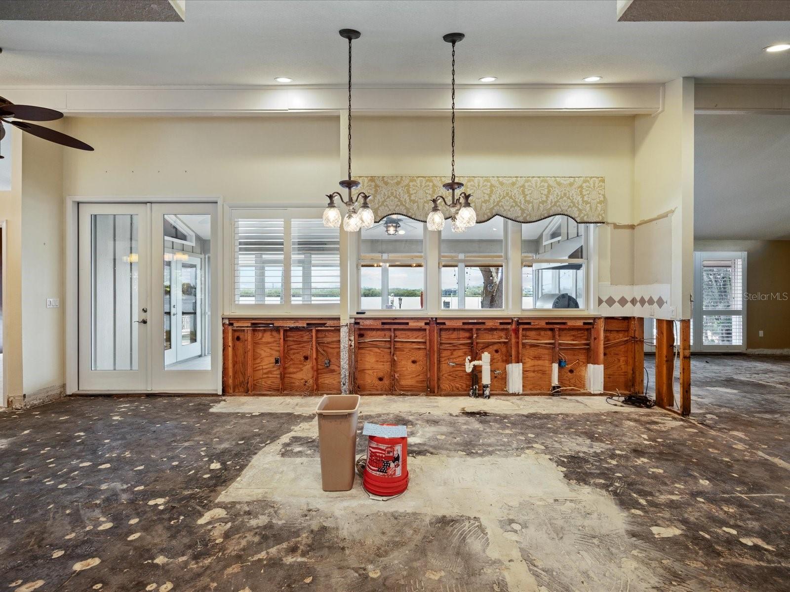 Kitchen from south hallway with conduit for center island