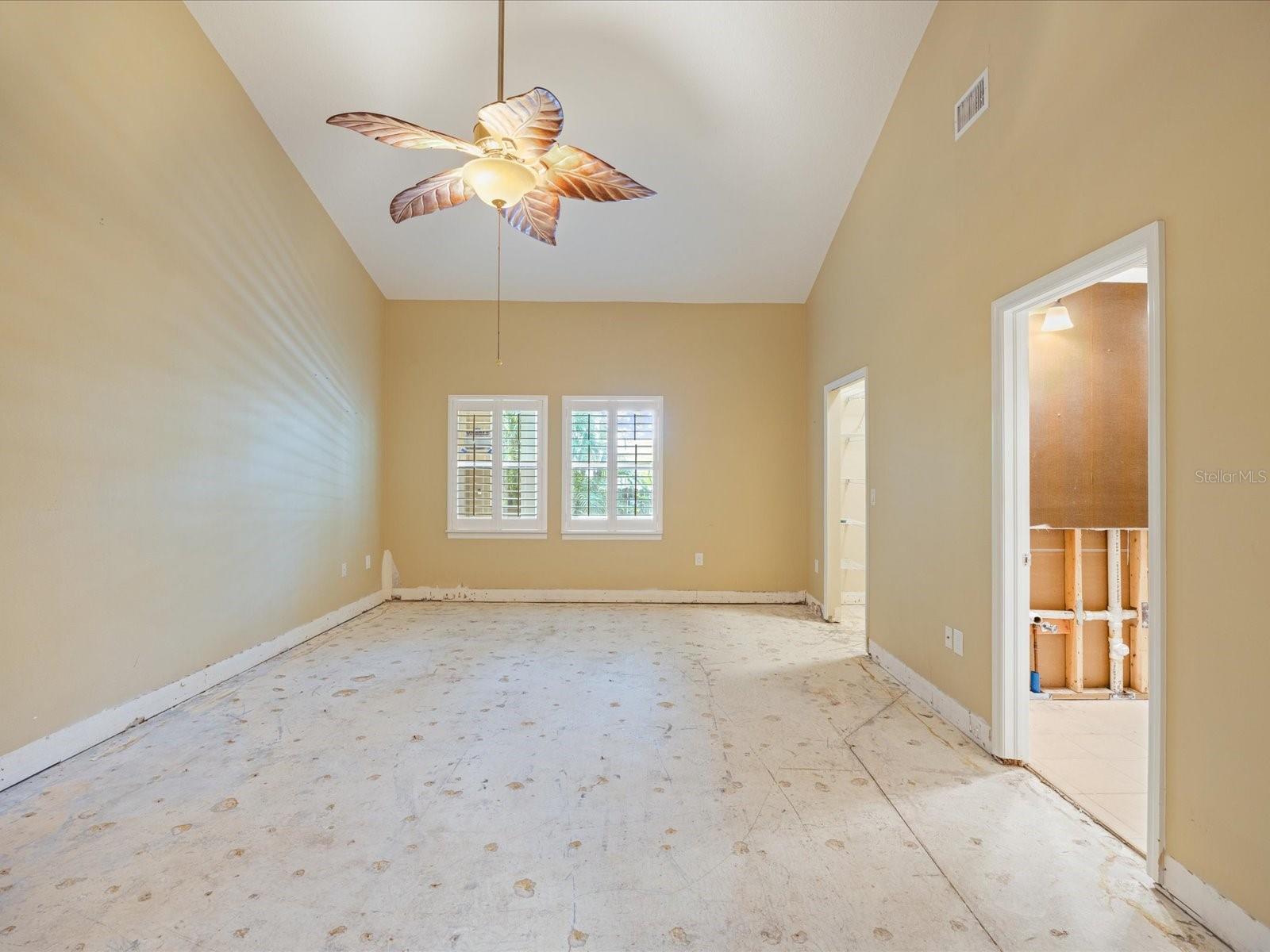 Primary with primary bath and walk in closet entrances on right