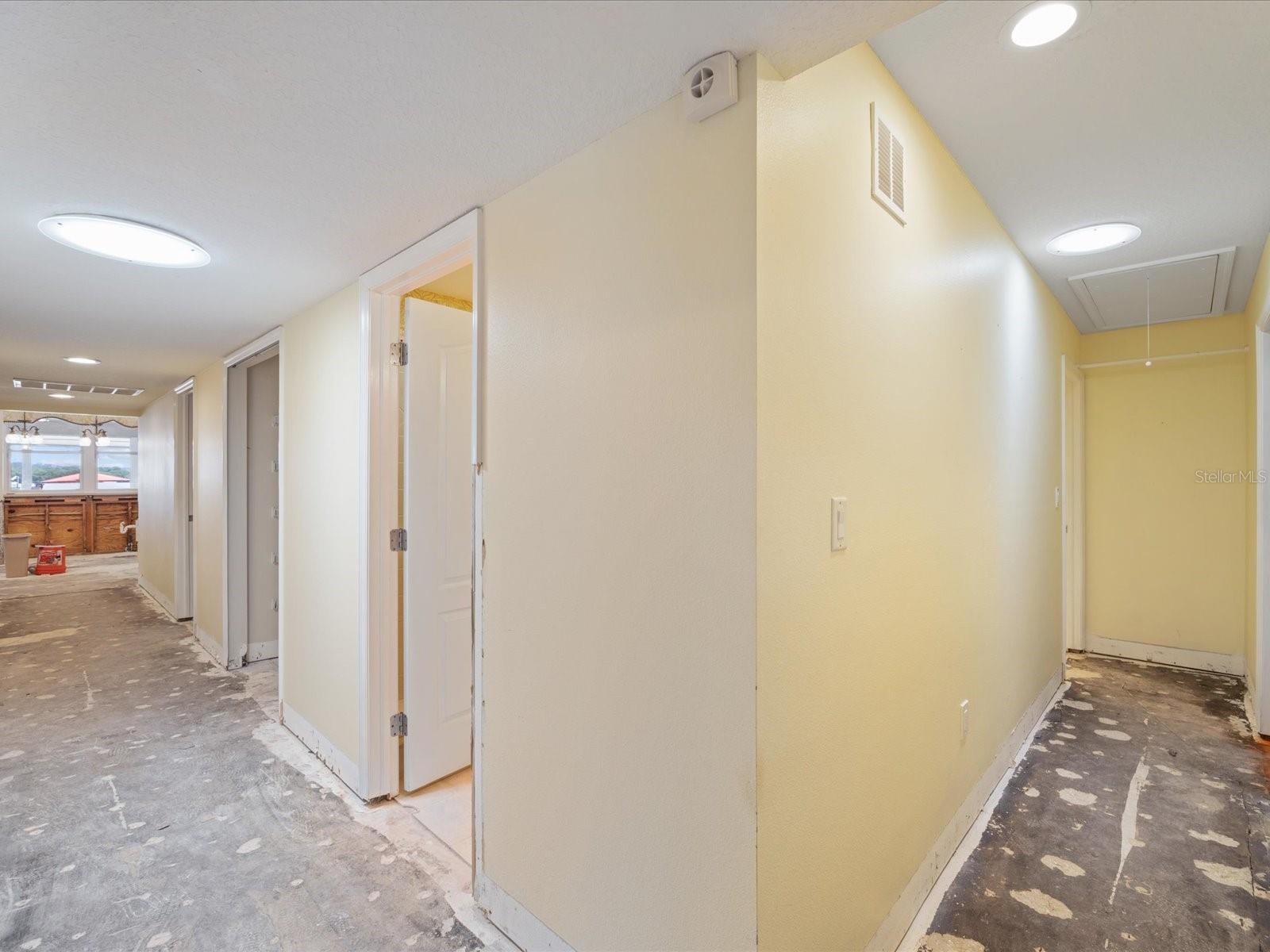 Hallway to 4th bedroom and laundry suite