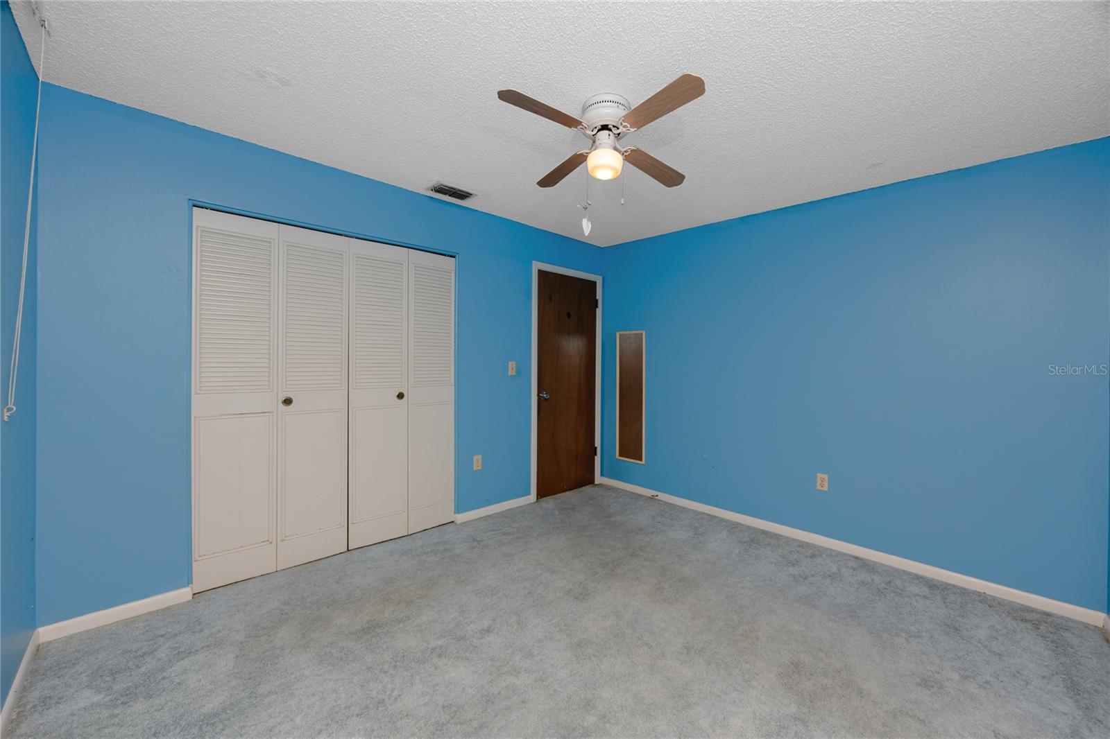 Guest bedroom with wall closet