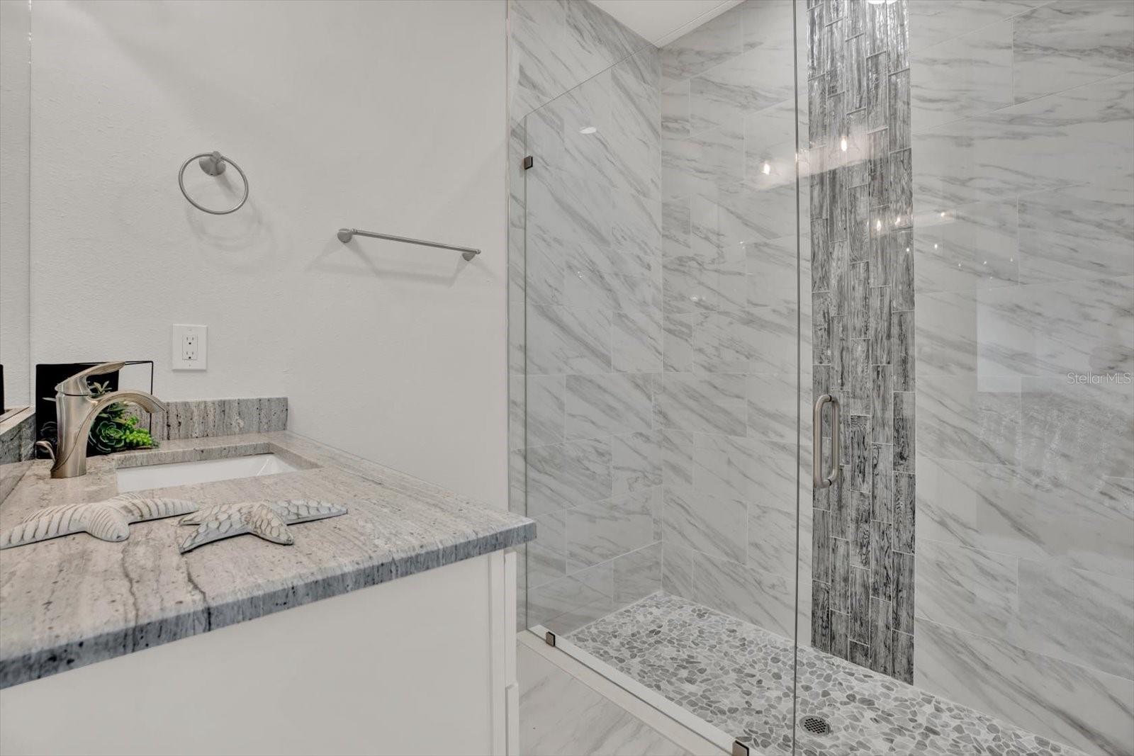 Walk in Shower with beautiful rainfall glass tiles