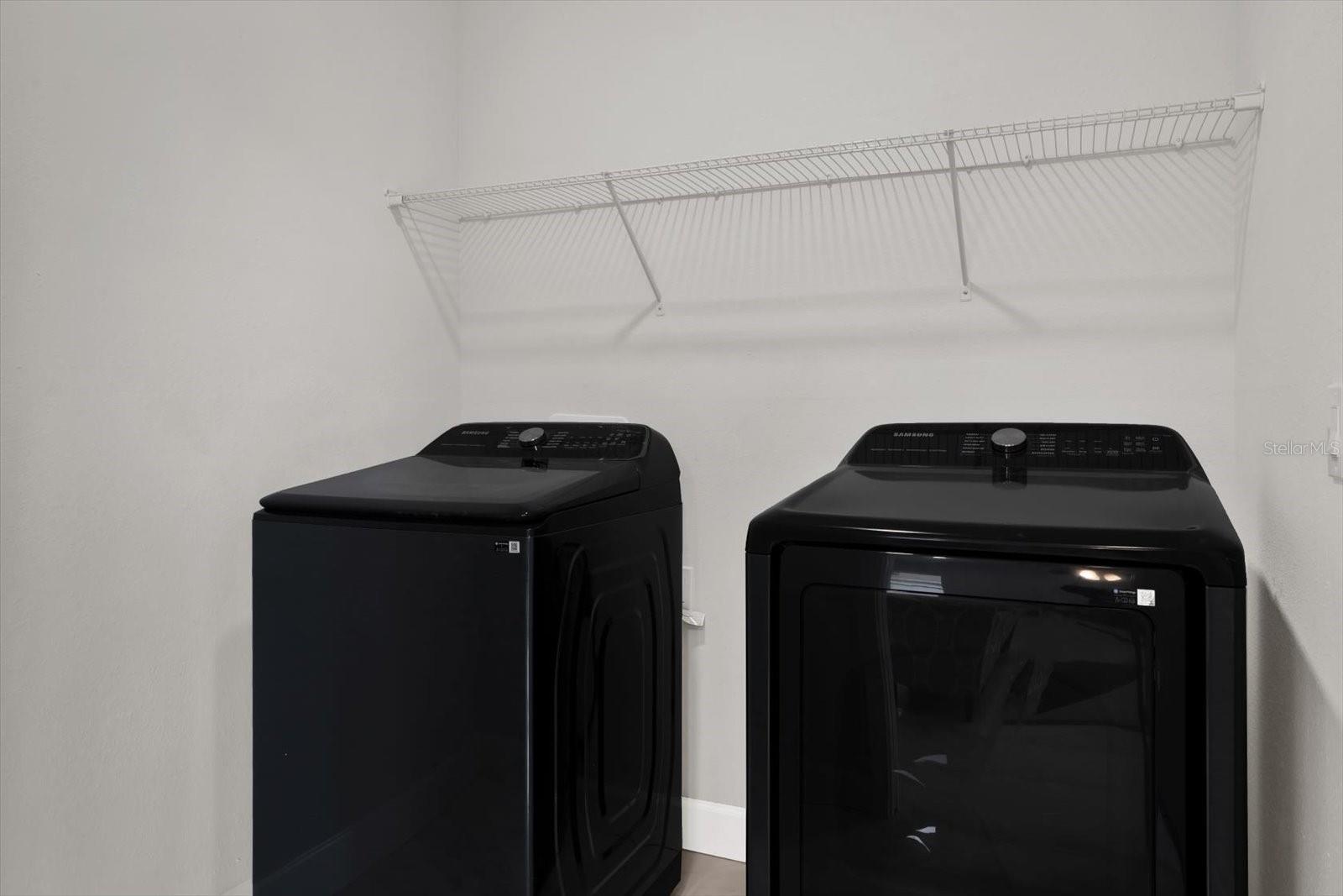 Laundry room with new washer/dryer off the garage and kitchen