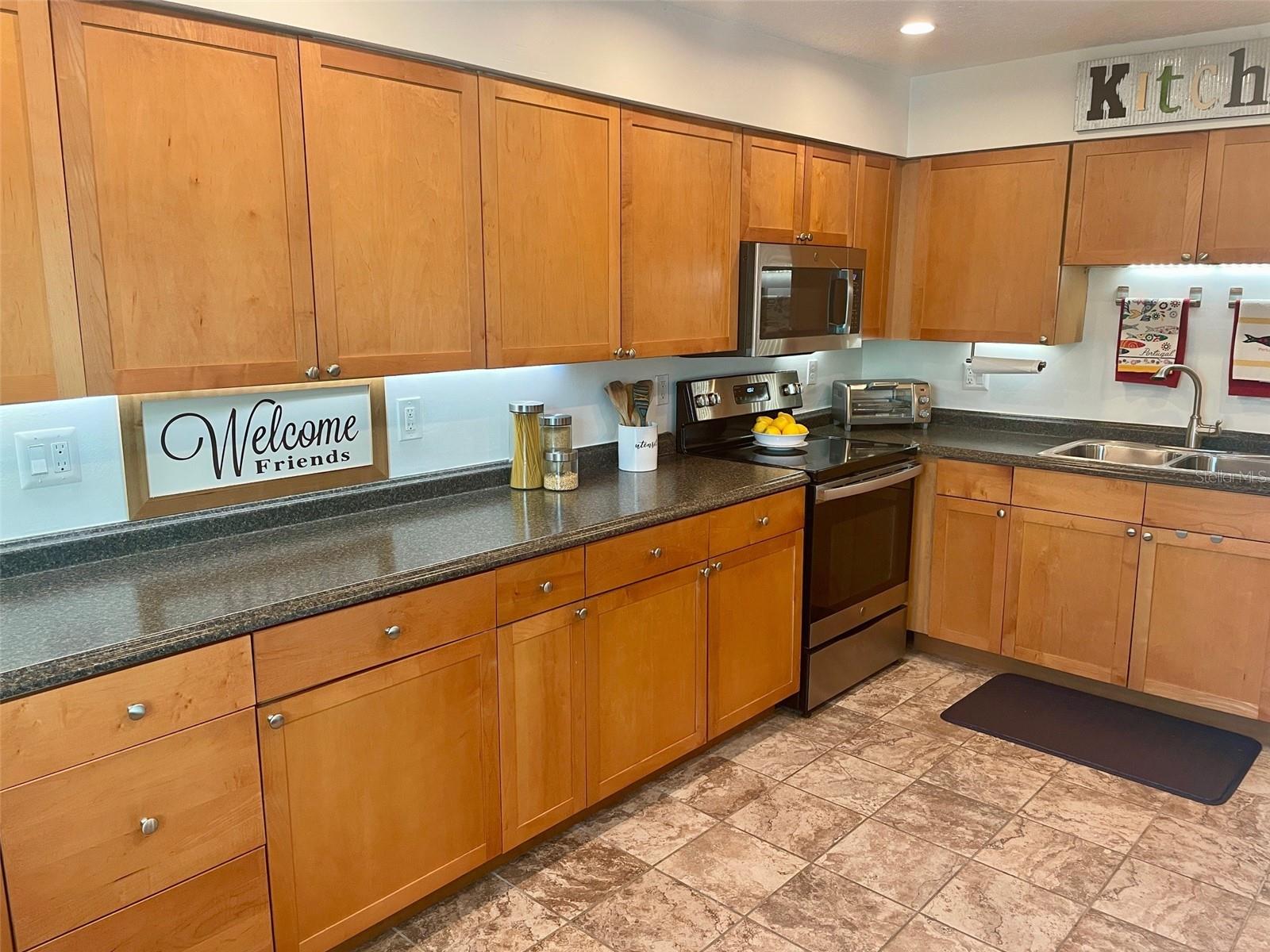 Kitchen has an abundance of counter & cabinets
