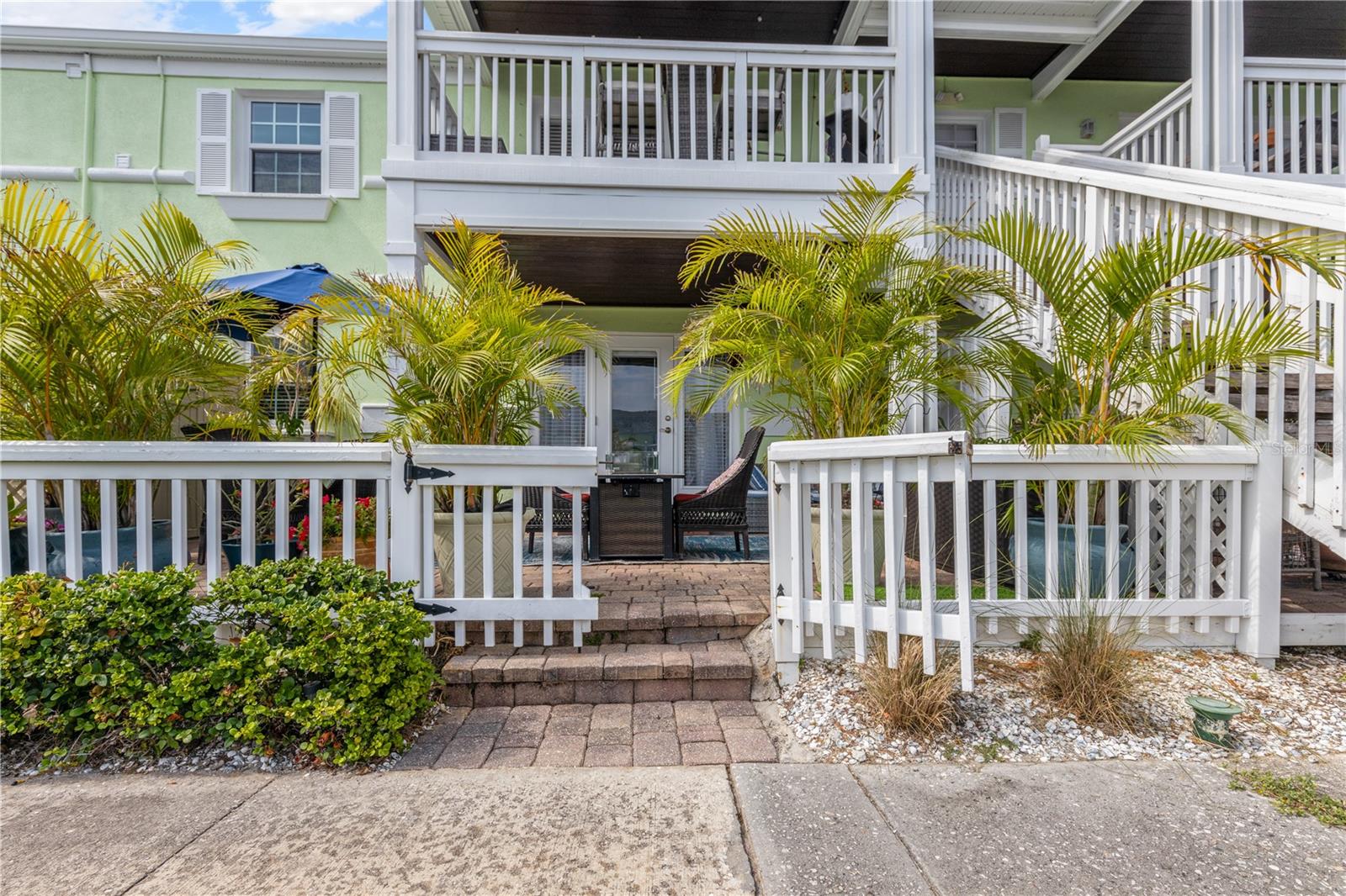 Walk into your patio from the sidewalk and water