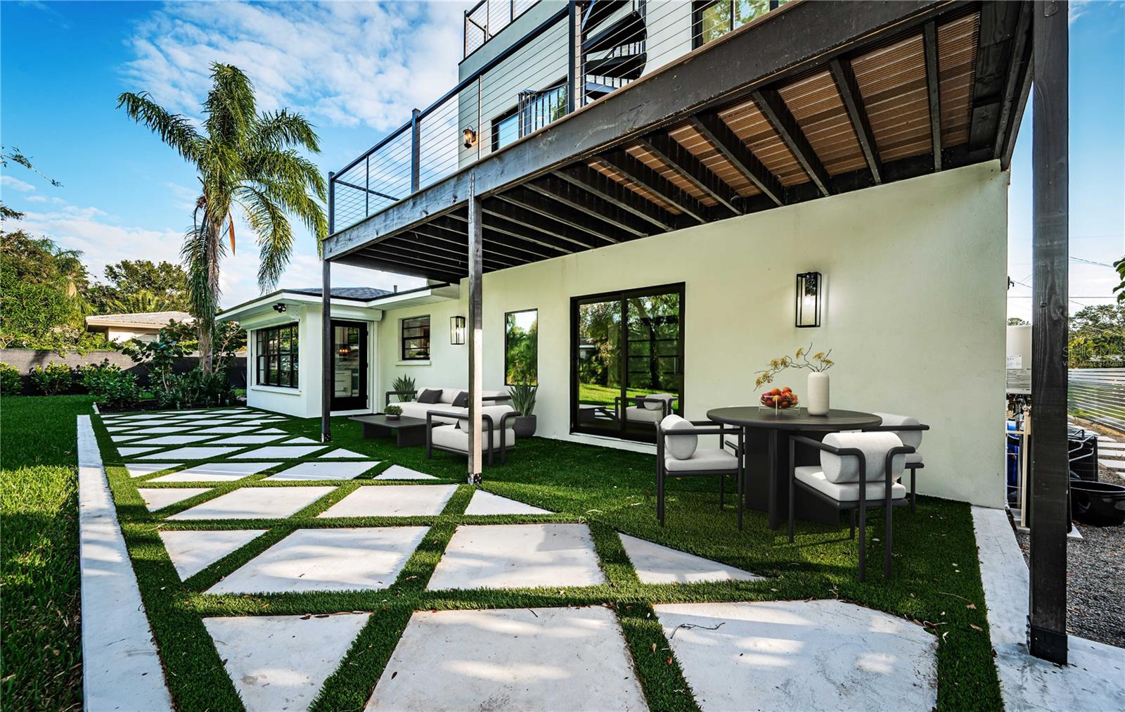 Virtually staged backyard patio area off the Family and Dining Room