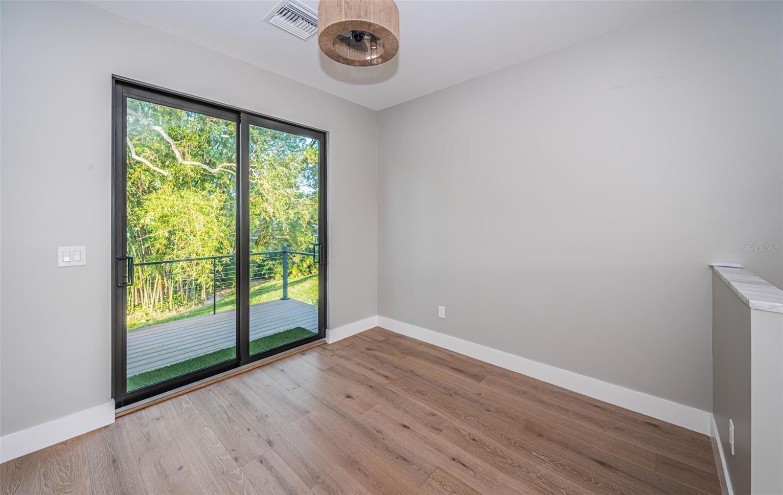 Upper Level Loft with sliding glass door to the North Balcony