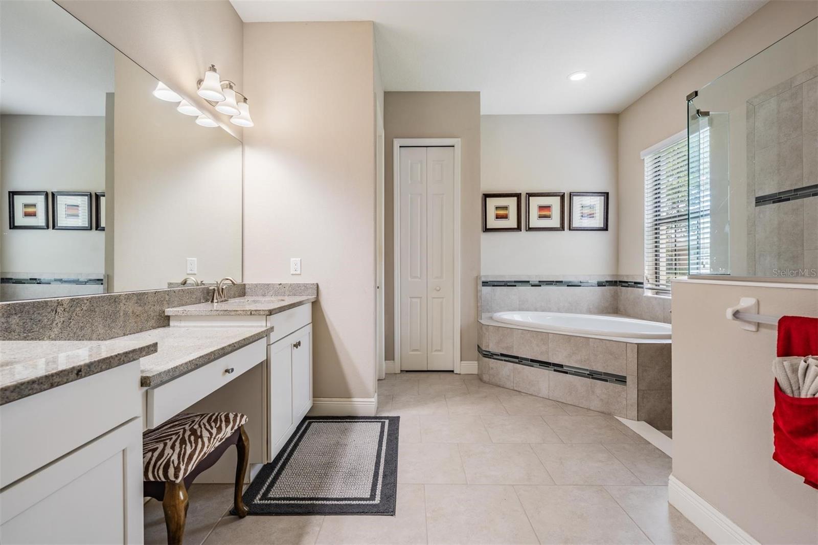 Dual sinks, large tub and walk-in shower