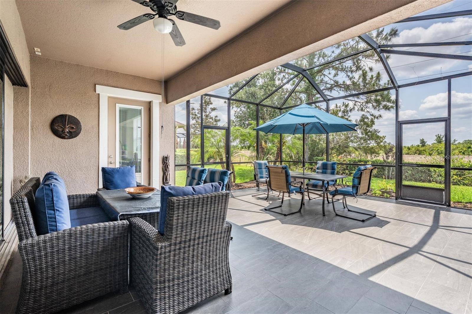 Wonderful outdoor space! Extended & caged w/tile floor!