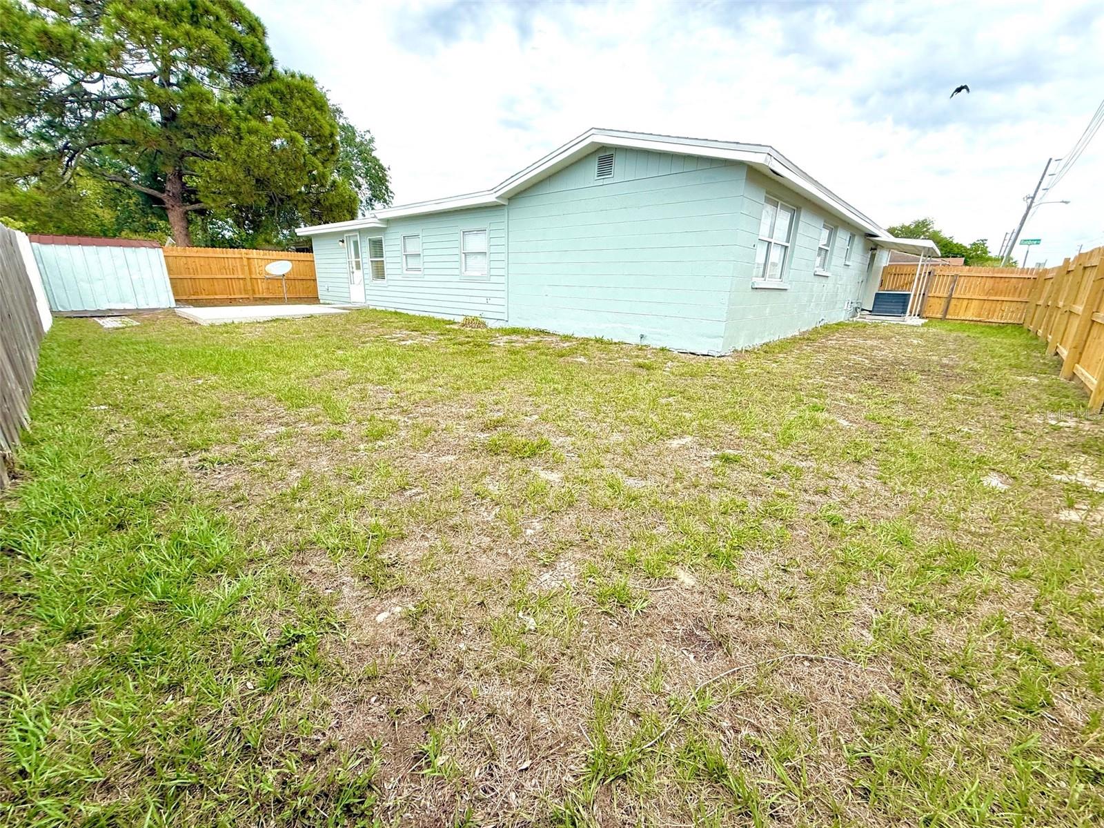 Very large and fully fenced back yard.