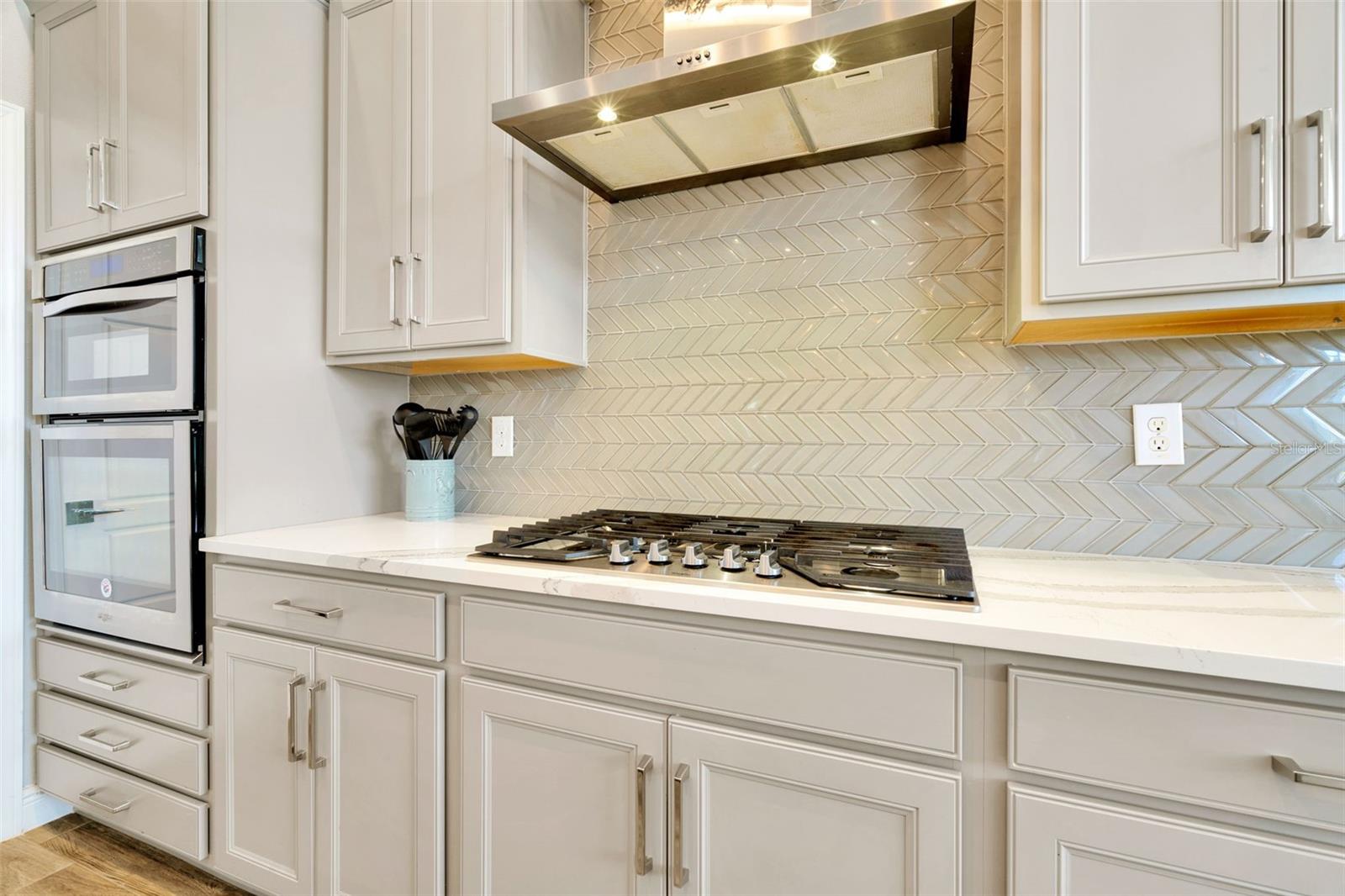 Chef’s kitchen features a gas cooktop