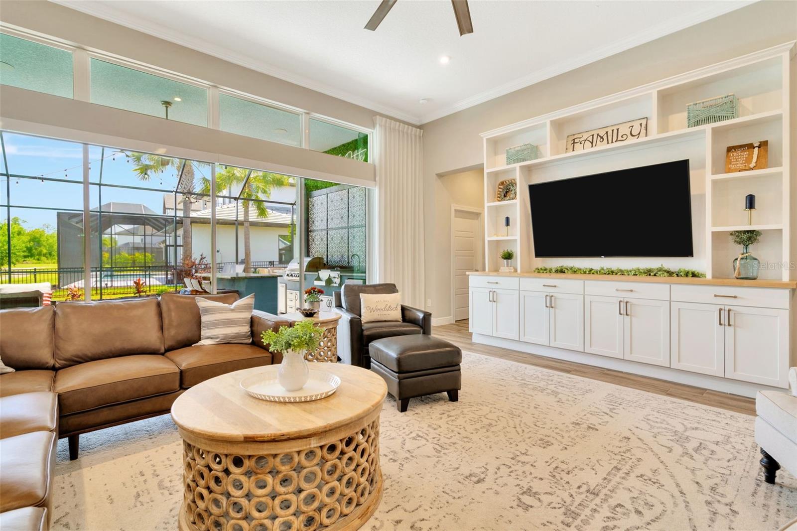 Great room features custom built in shelving