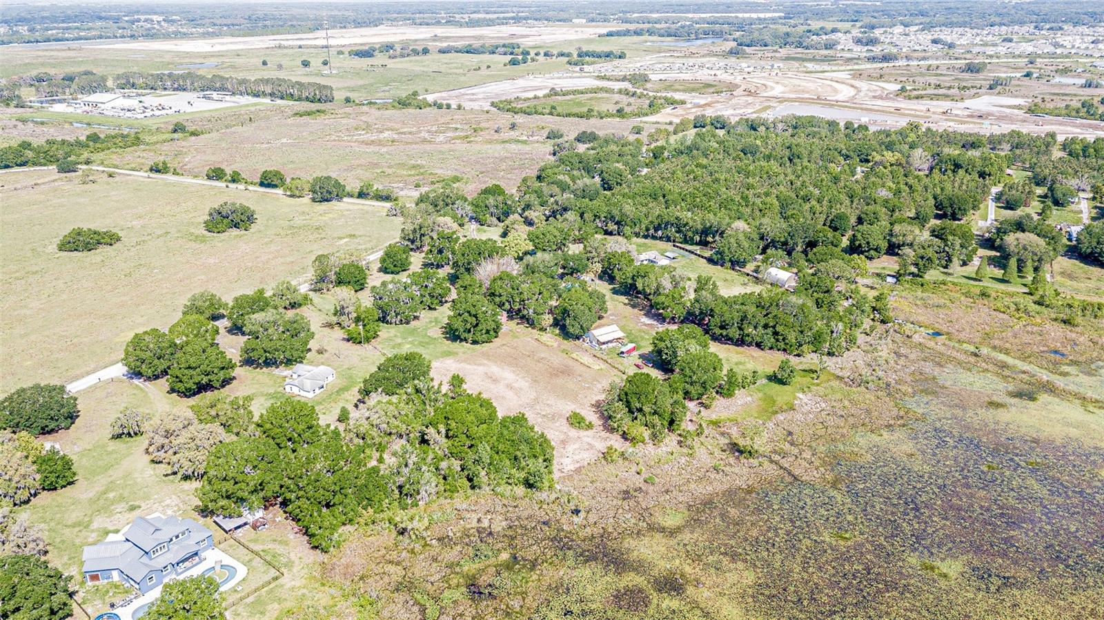 view from over near the lake back to the property