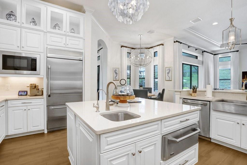 Gourmet kitchen with GE Monogram warming drawer, reserve osmosis and island sink.