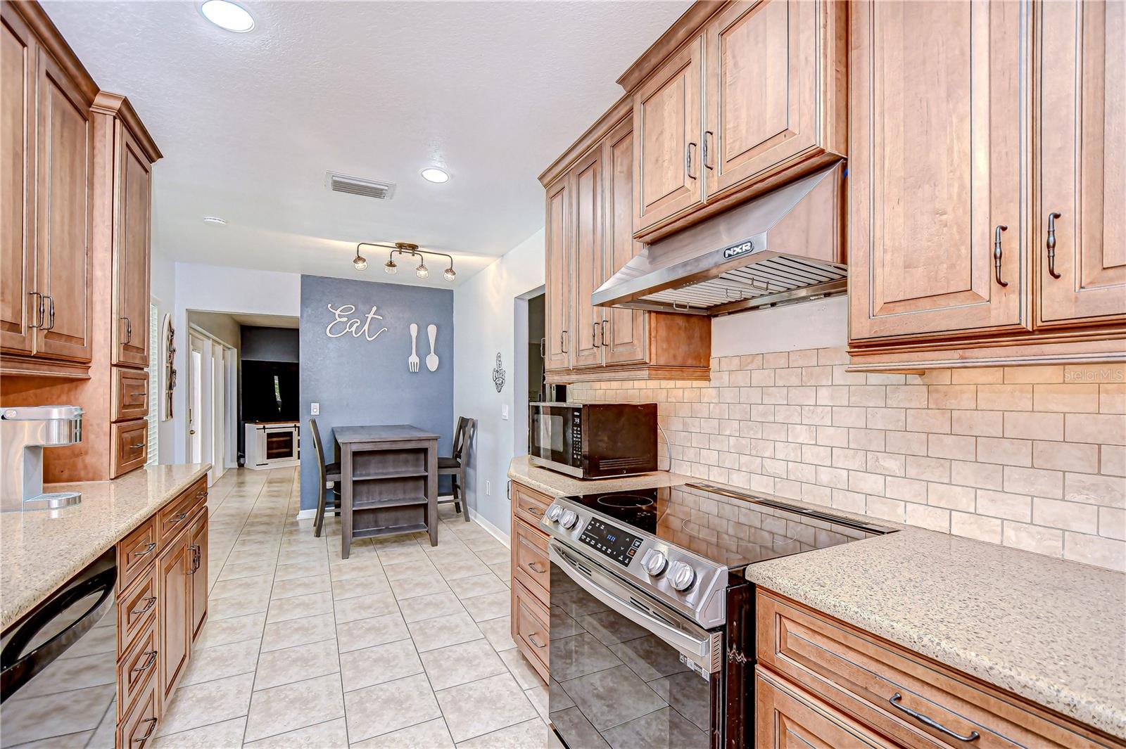 There is a sunny breakfast nook open to the kitchen as well!