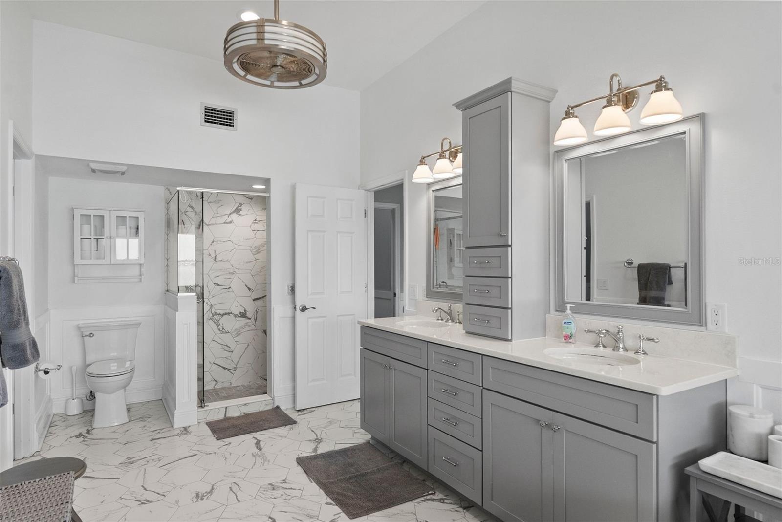 Walk-in shower, hexagonal porcelain tile.