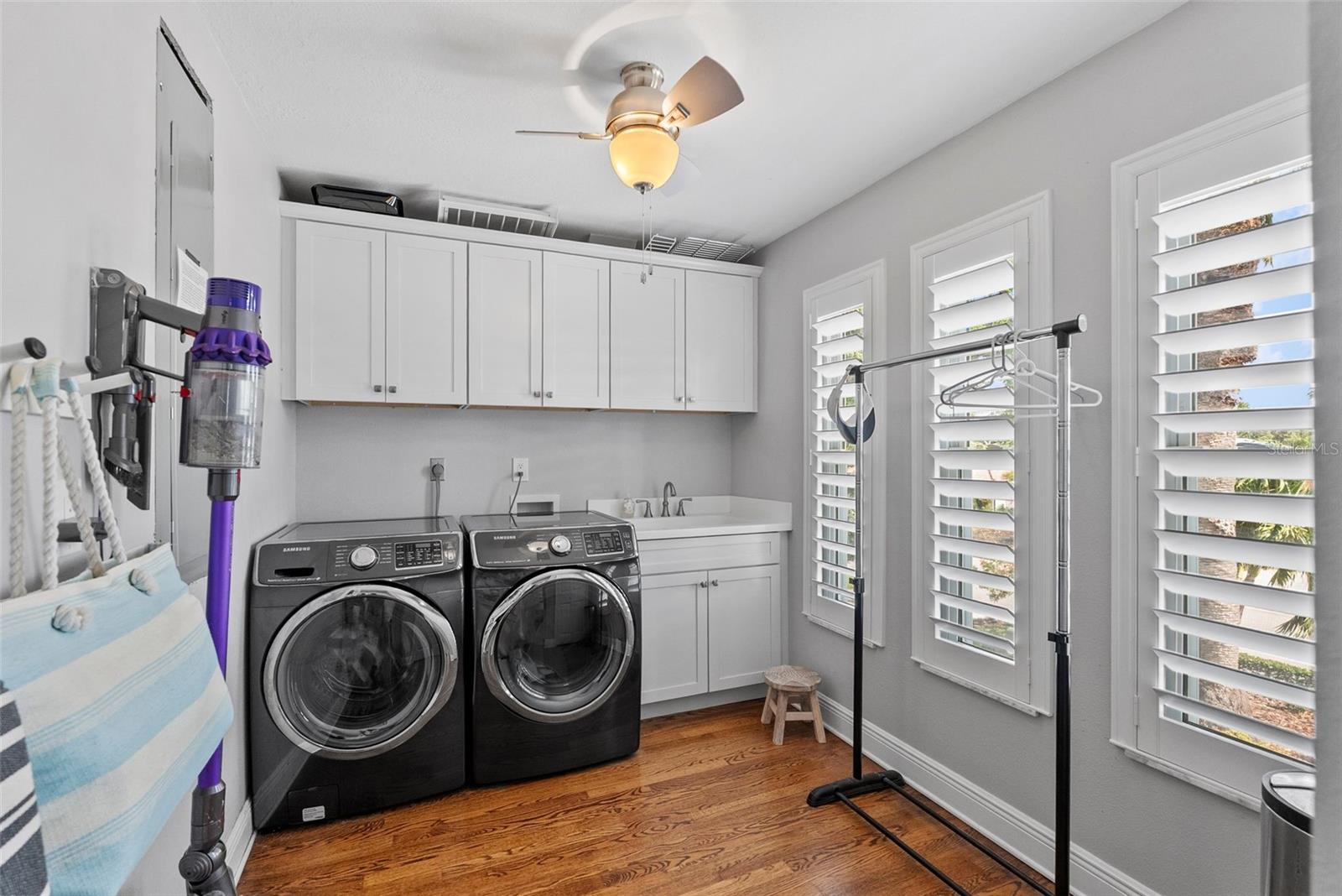 Spacious and bright laundry with tons of storage.