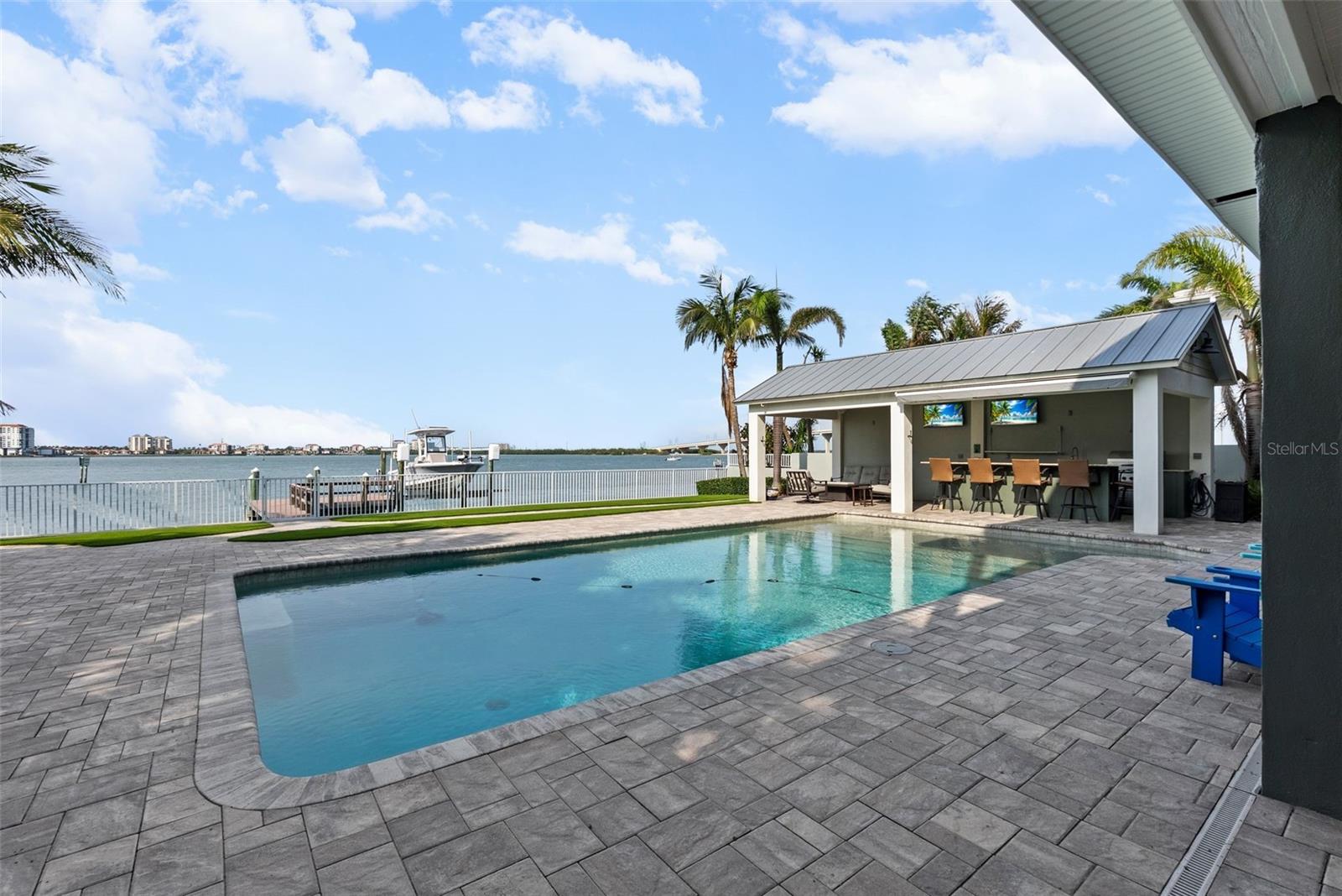 Huge pool with lovely paver deck.