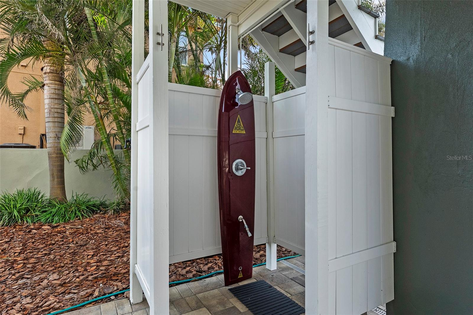 Super cool outdoor shower made from a surf board!