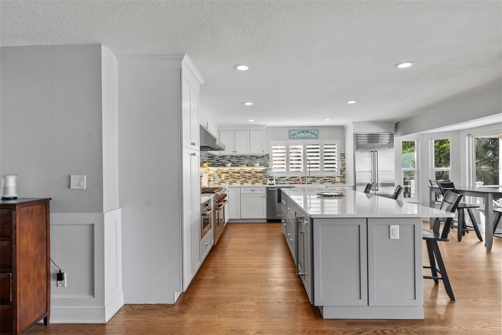 Huge kitchen island with Cambria Quartz counters.