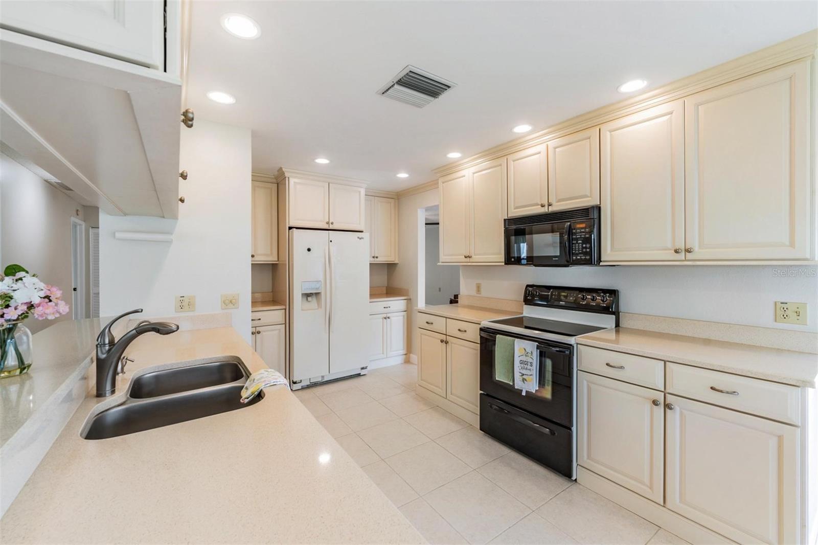 Updated Kitchen is open to the Family room & offers plenty of cabinetry & newer applicances.