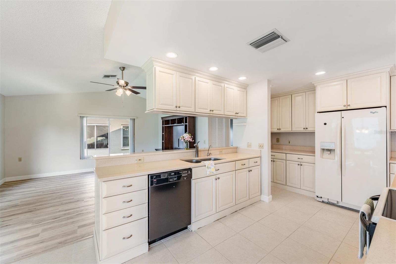 Updated Kitchen is open to the Family room & offers plenty of cabinetry & newer applicances.