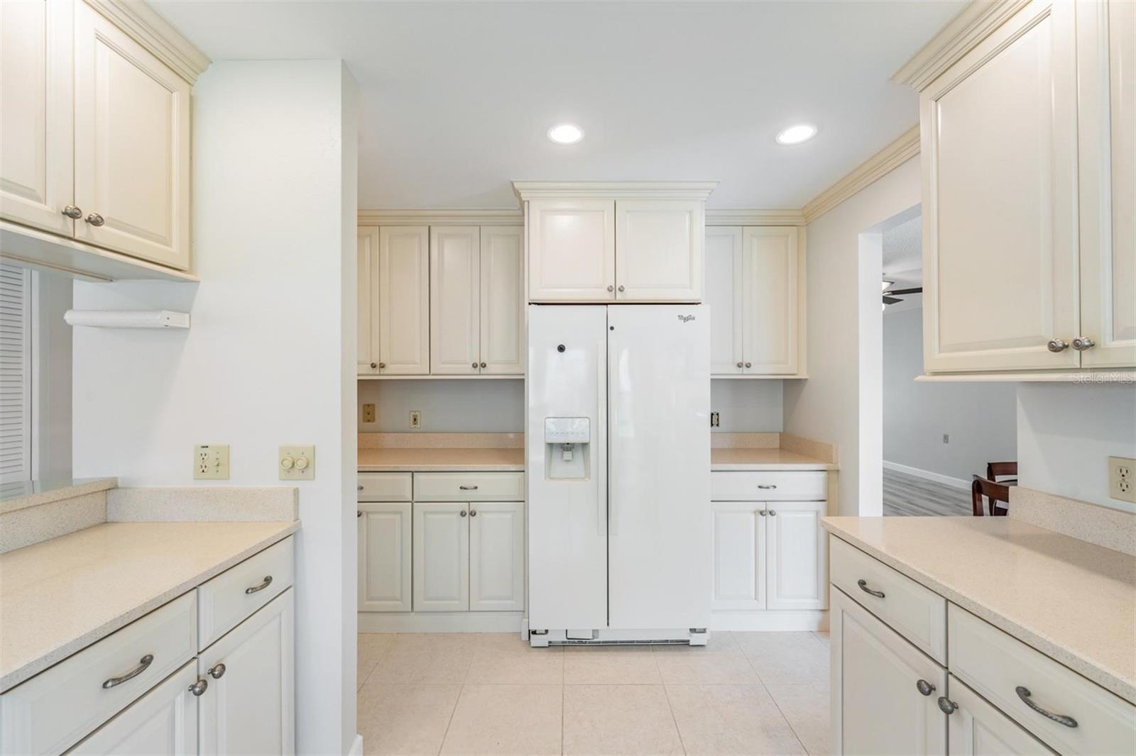 Updated Kitchen is open to the Family room & offers plenty of cabinetry & newer applicances.