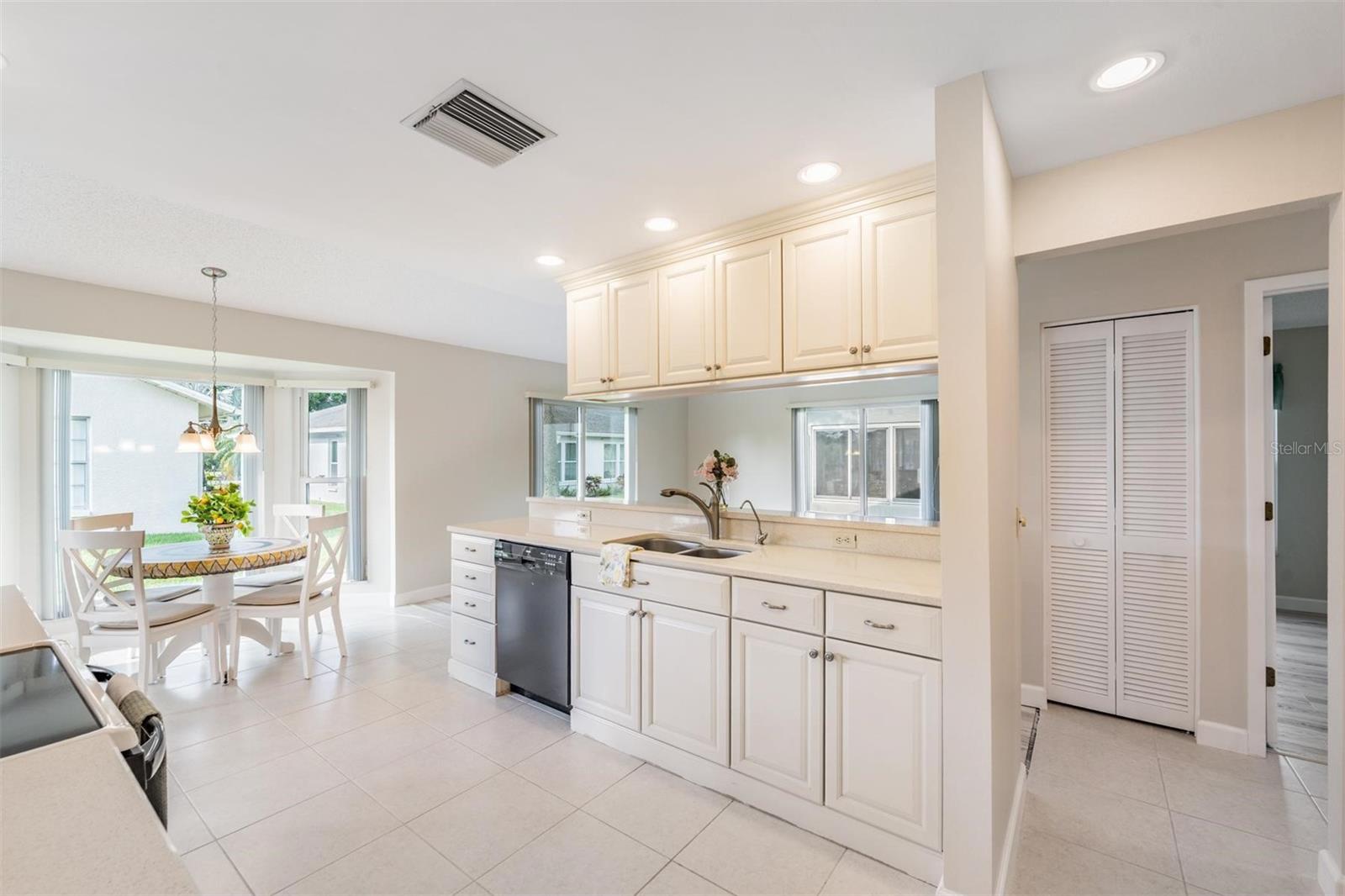 Updated Kitchen is open to the Family room & offers plenty of cabinetry & newer applicances.