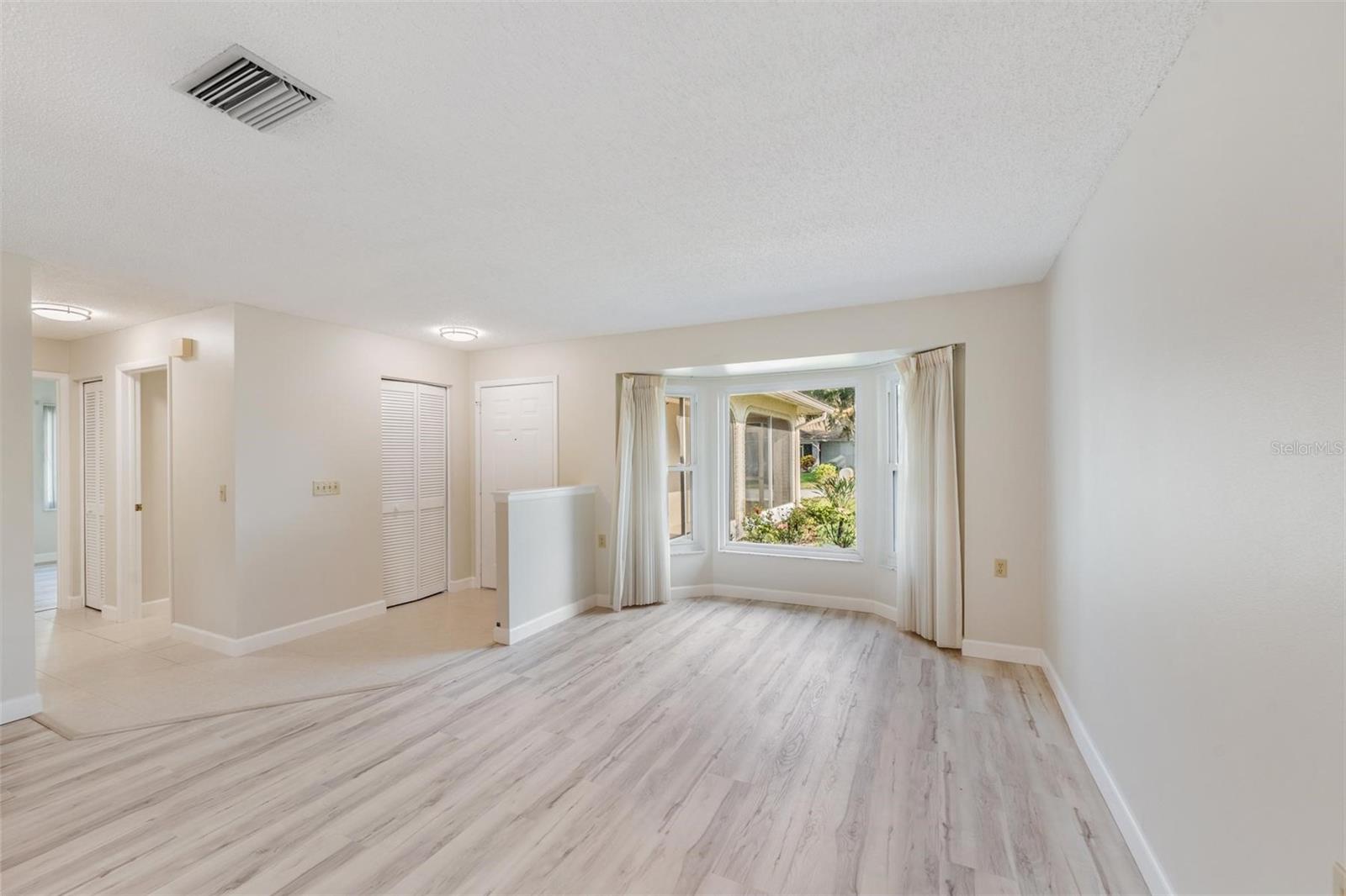 Living Room / Entry door. View from Dining area.