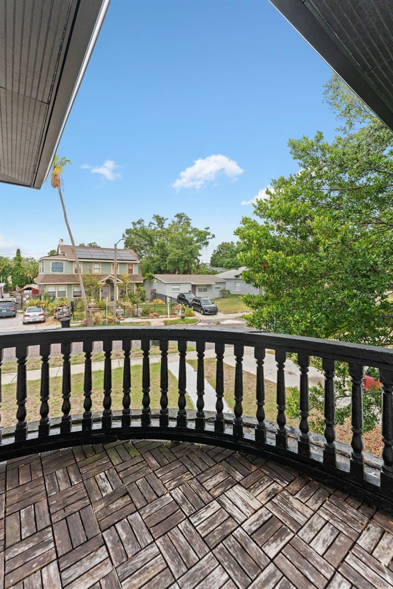 Balcony with decorative iron parapet for second large bedroom
