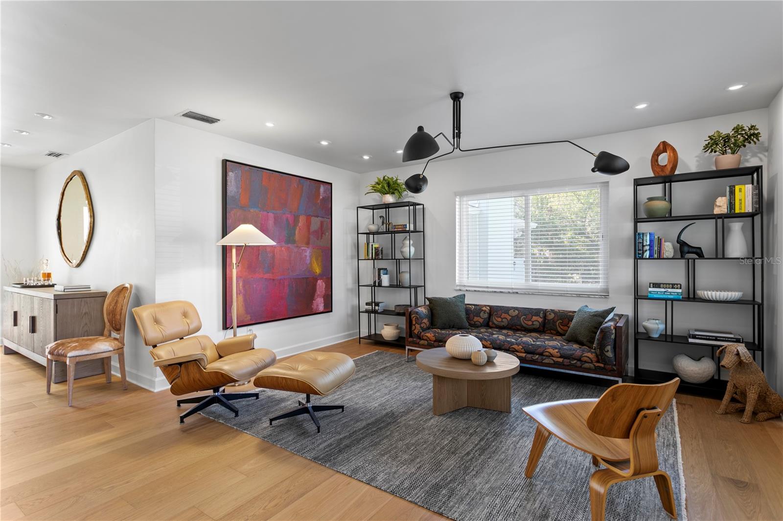 As you step inside you’re greeted by a flexible floor plan including a front sitting/living room—perfect as a formal dining area or cozy lounge —which leads to an additional space, perfect for dining or an additional sitting area.