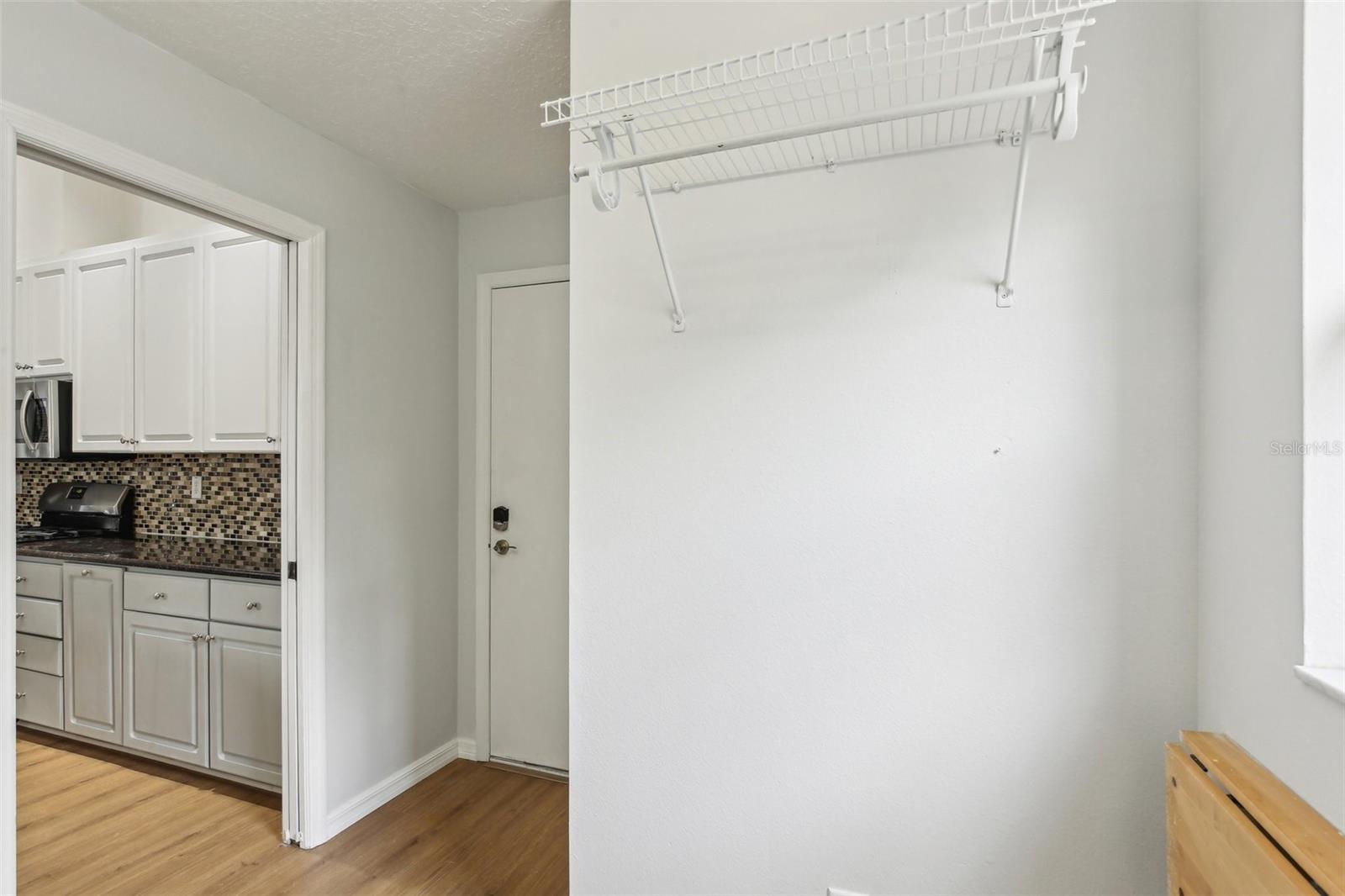 LAUNDRY ROOM CONVENIENTLY LOCATED OFF KITCHEN WASTES NO SPACE WITH A POCKET DOOR