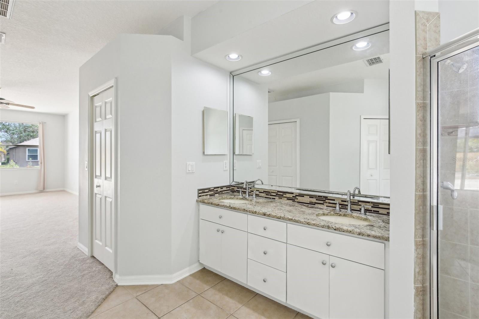 PRIMARY SUITE HAS DUAL SINK VANITY