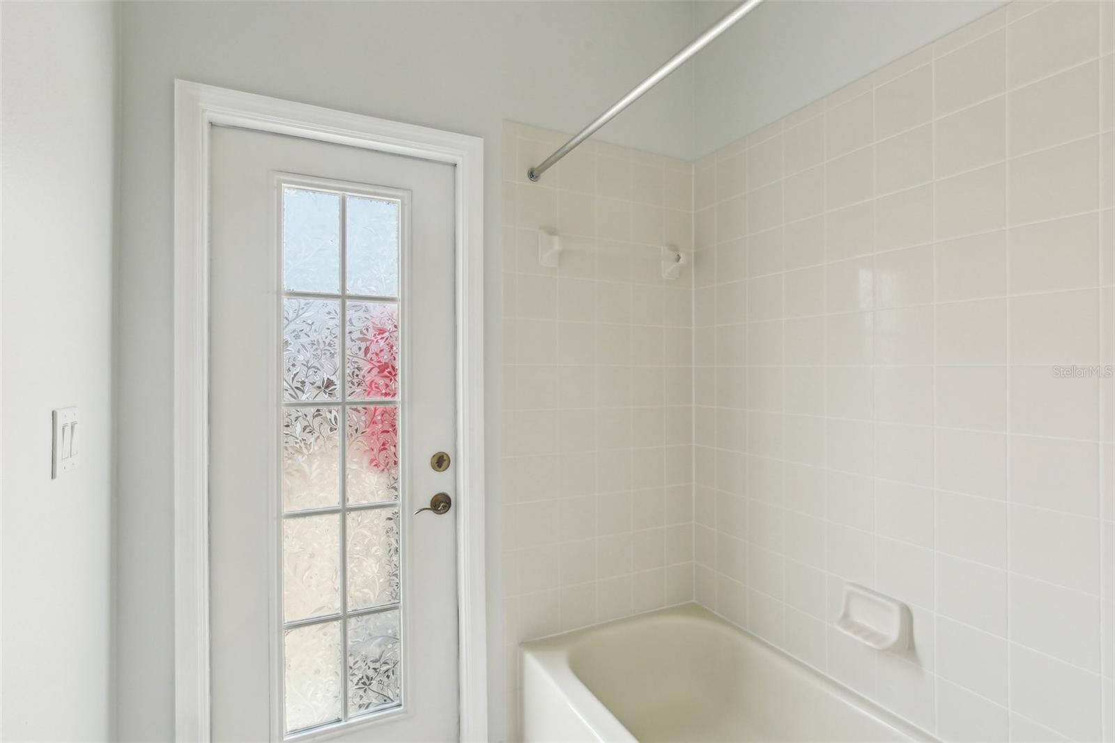 BATHROOM 3 HAS STEP-IN TUB AND DOOR TO OUTSIDE. MAKE THIS YOUR POOL BATH AFTER YOU ADD A POOL!