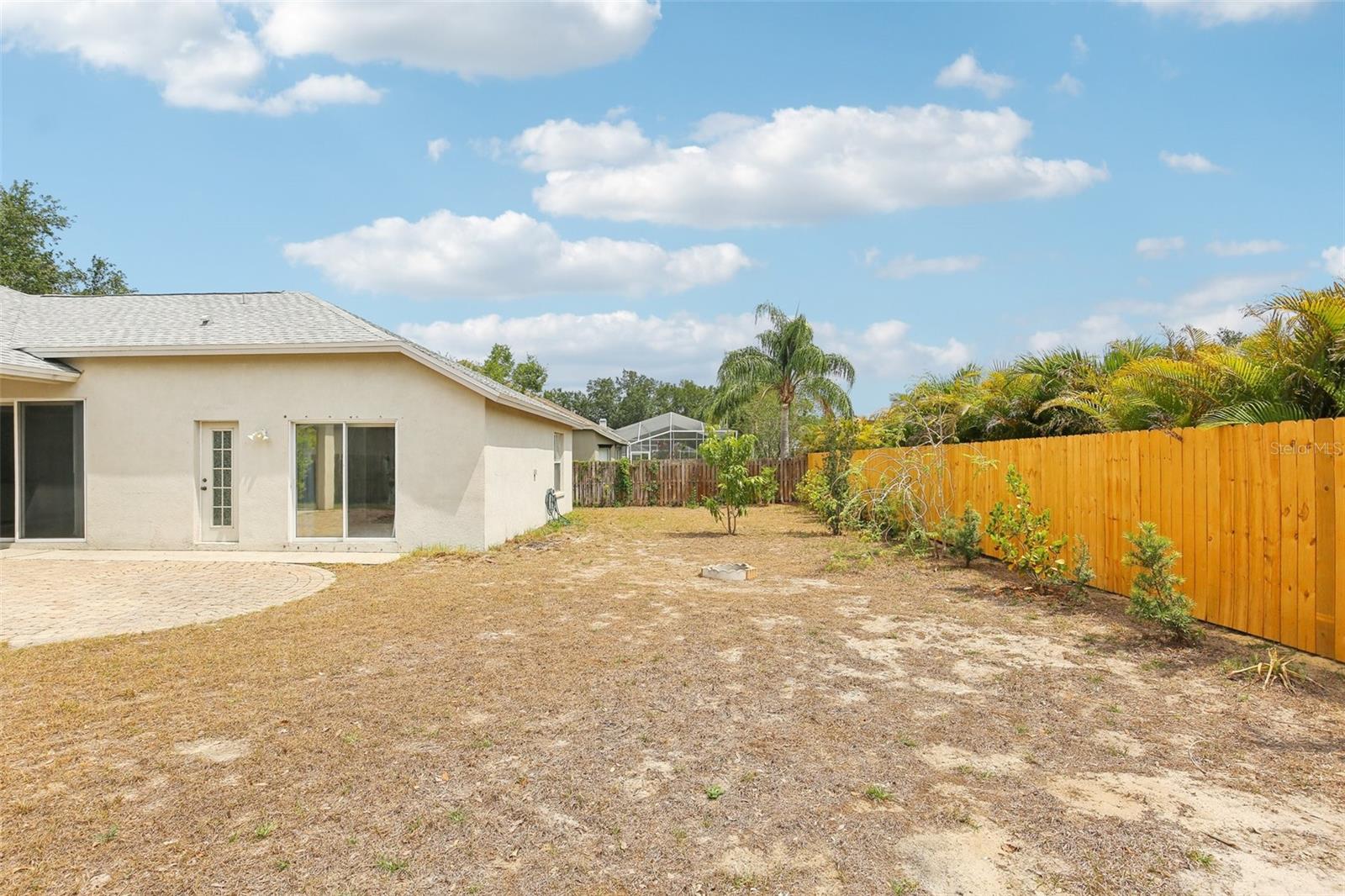 PLENTY OF SIDE YARD WITH FRUIT TREES FOR FUN
