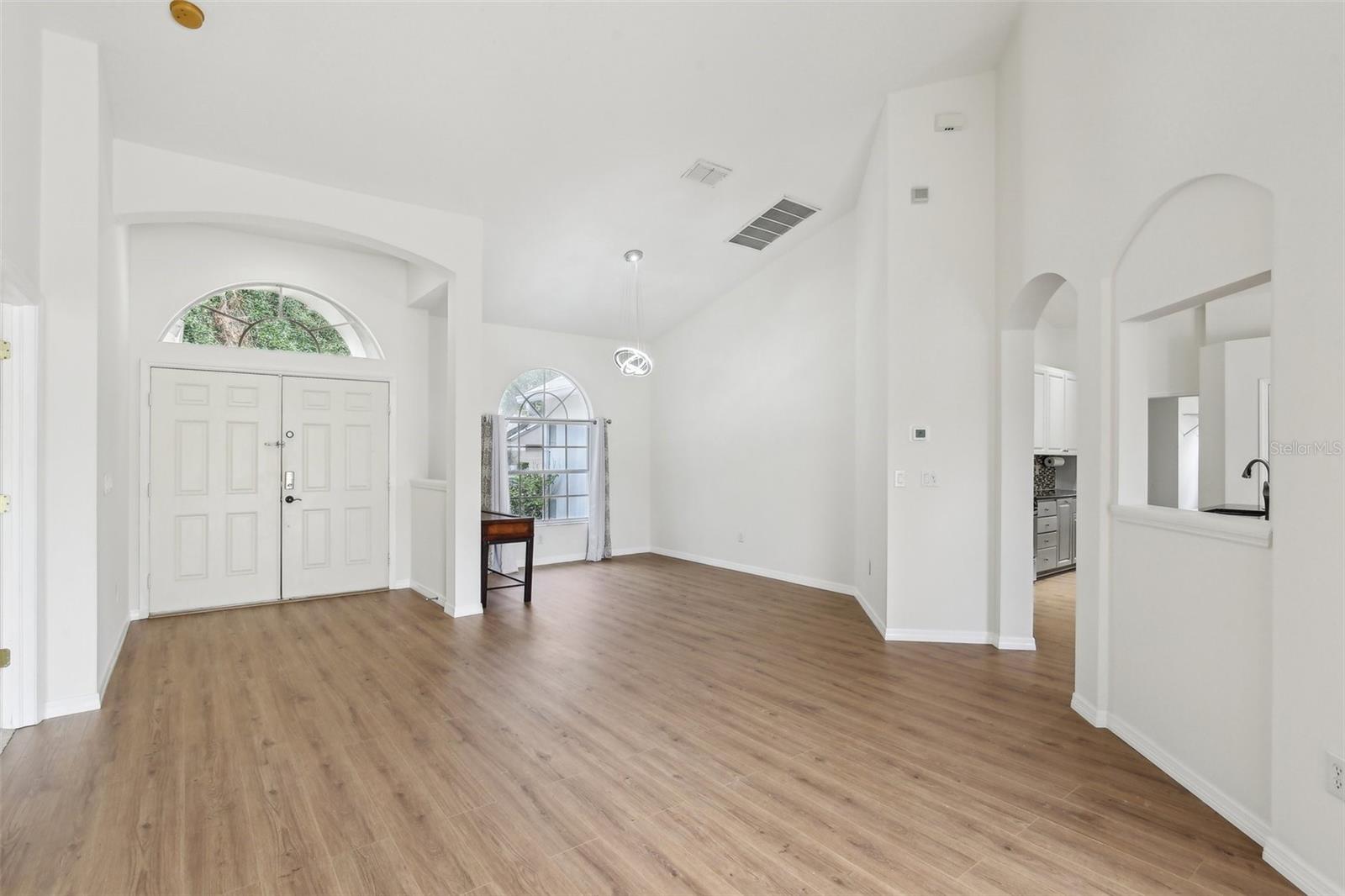 SPACIOUS ENTRY OVER LOOKS FORMAL DINING ROOM AND LIVING ROOM