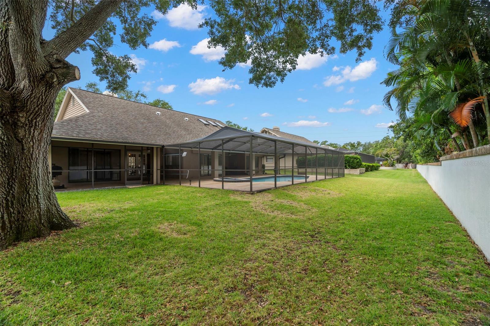 Large private backyard backs up to back of wooded church lot.