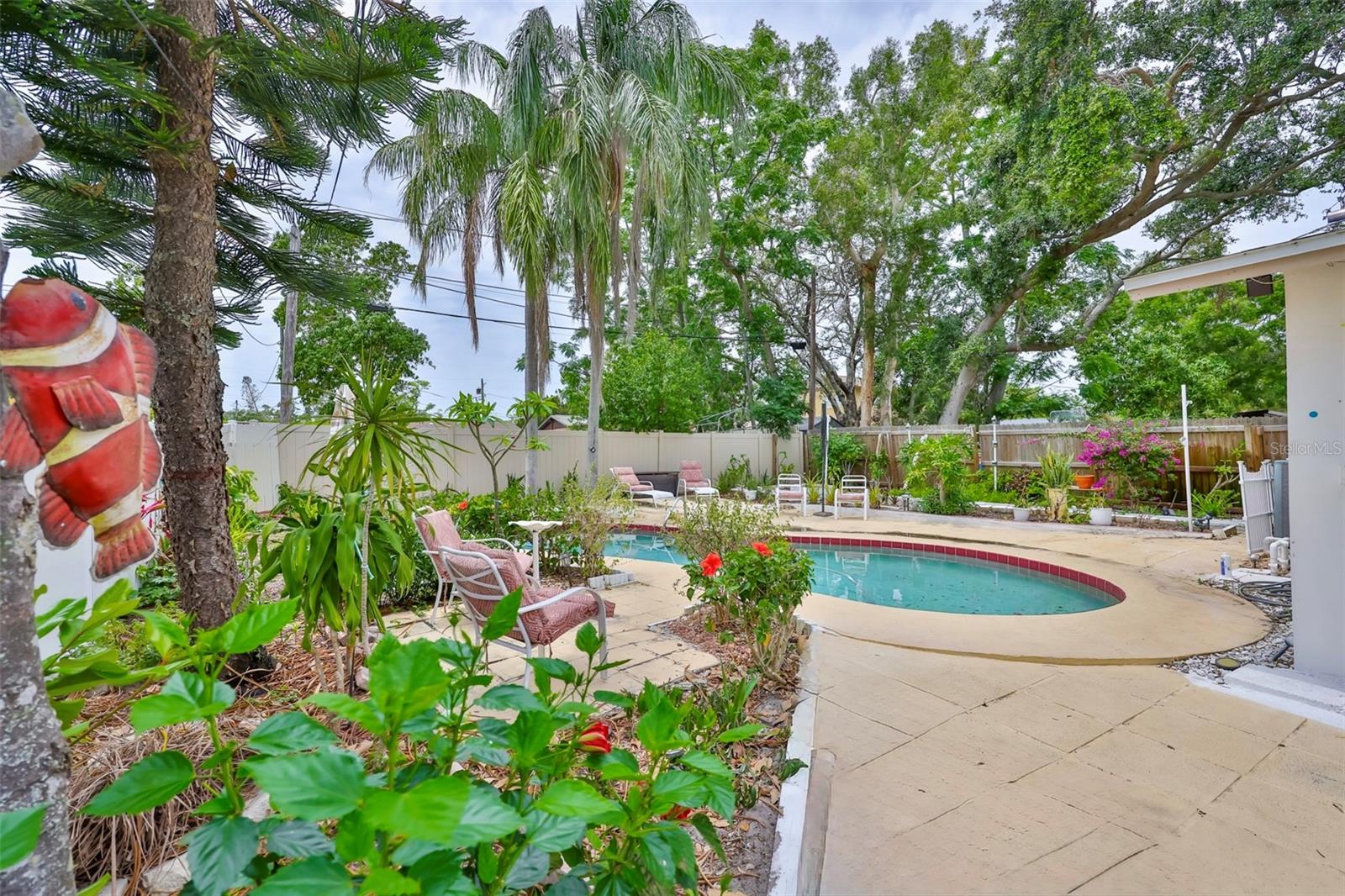 Backyard Oasis with Lush Gardens and Sparkling Pool