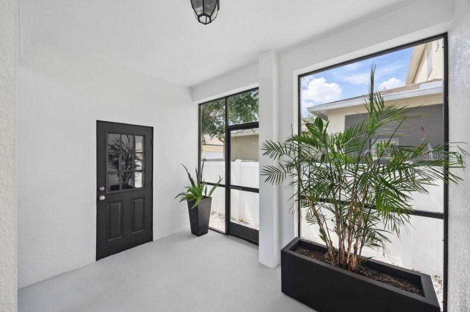 Covered area from garage and spacious area for dining