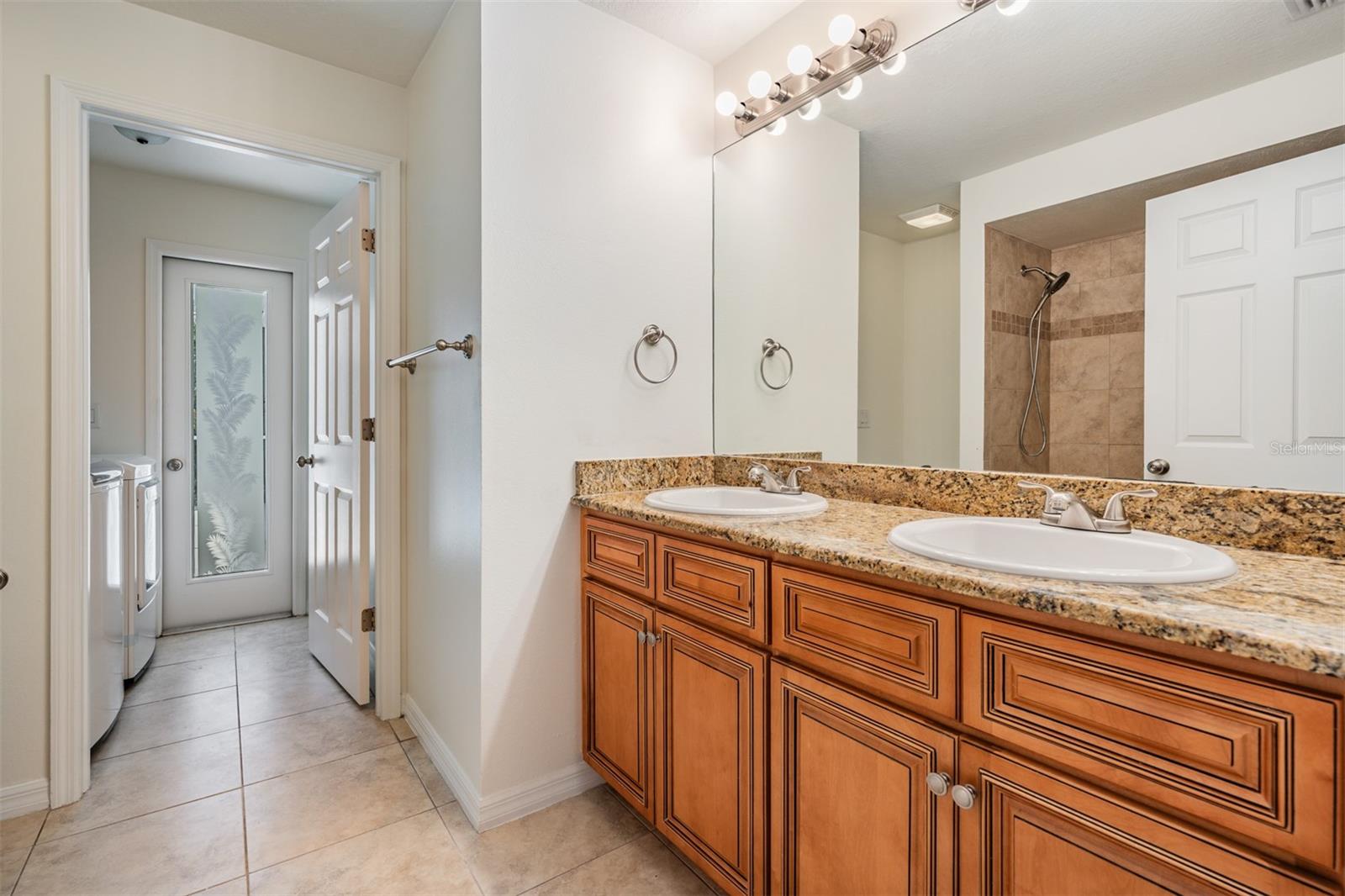 Full Guest Bathroom, Laundry Room, and Pool Patio Access