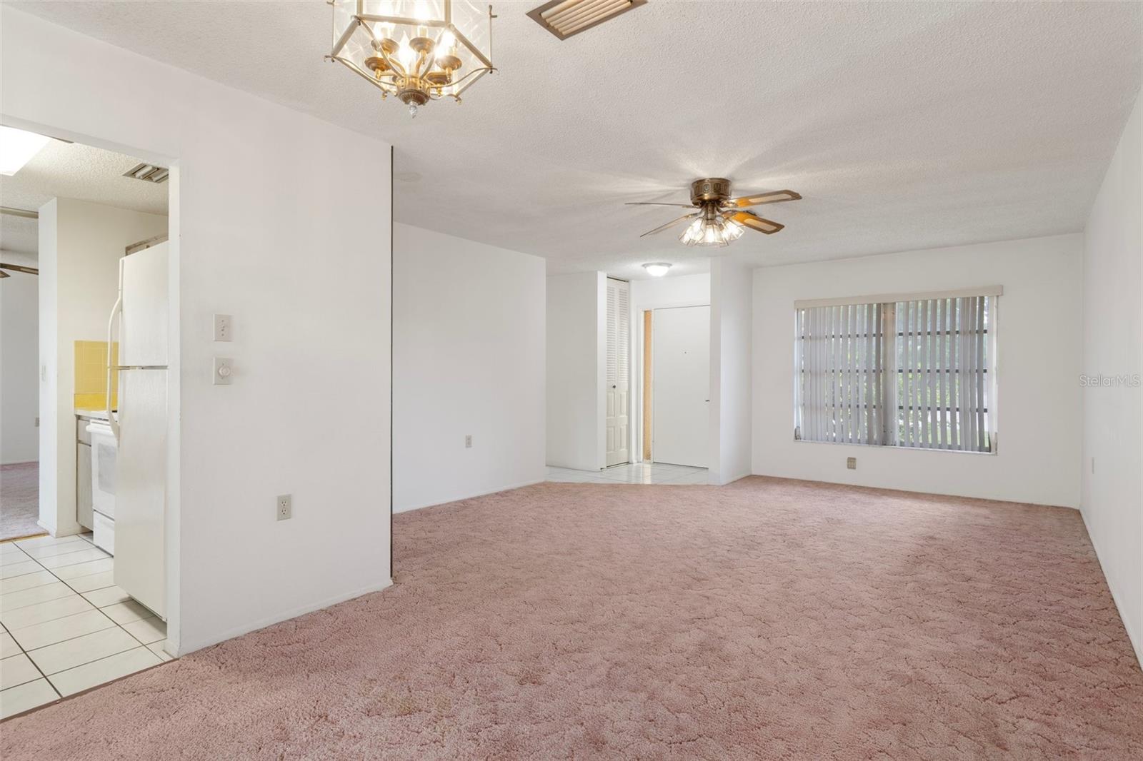 VIEW OF LIVING ROOM/KITCHEN FROM DINING AREA