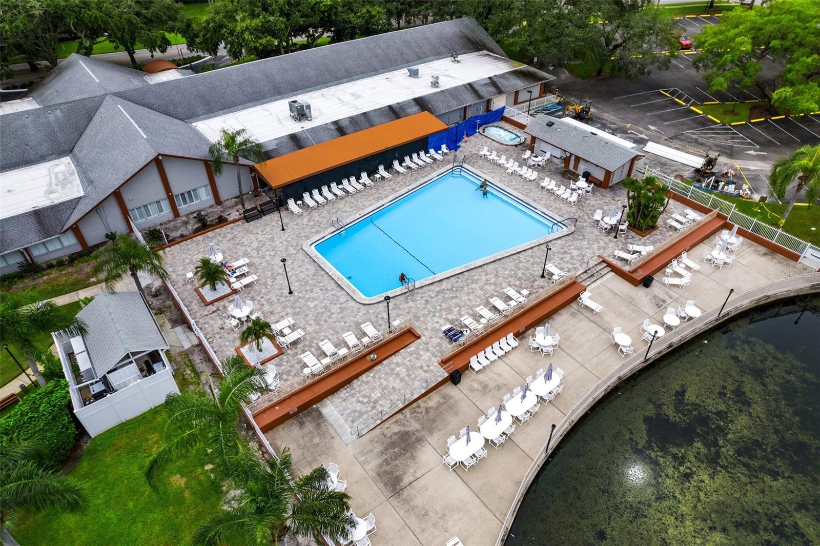 AERIAL VIEW OF CLUBHOUSE, POOL, AND SUNDECK