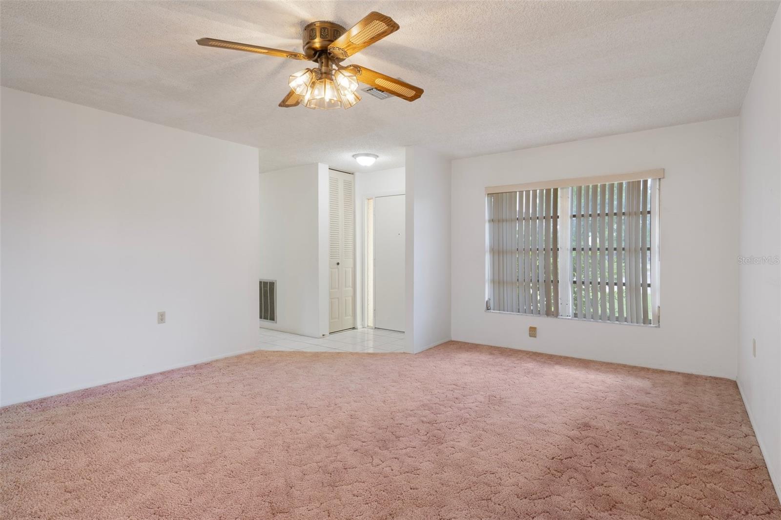LIVING ROOM, FRONT DOOR AND WINDOW