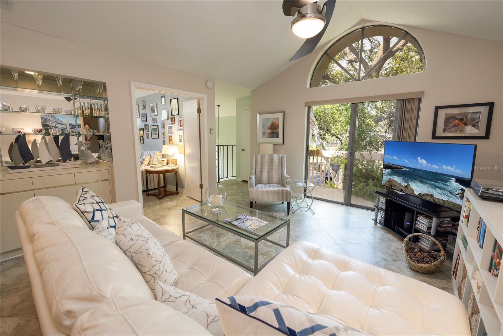 Living room has slider doors leading to the balcony