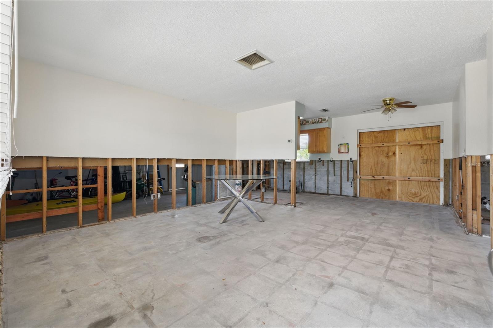 Dining & Kitchen Combo with French Door Opening to Backyard.