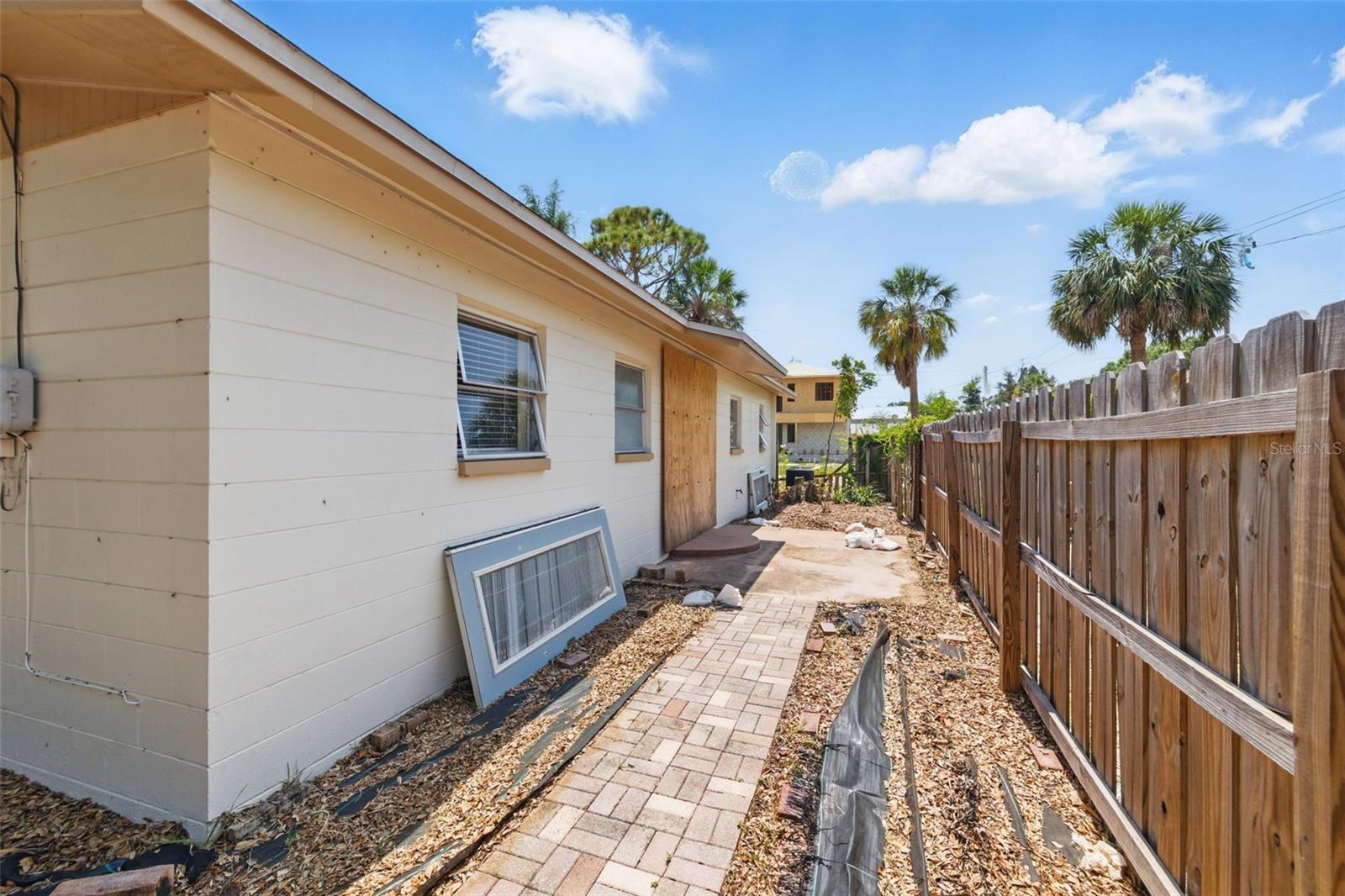 Sideyard with plenty of room for a patio & garden.