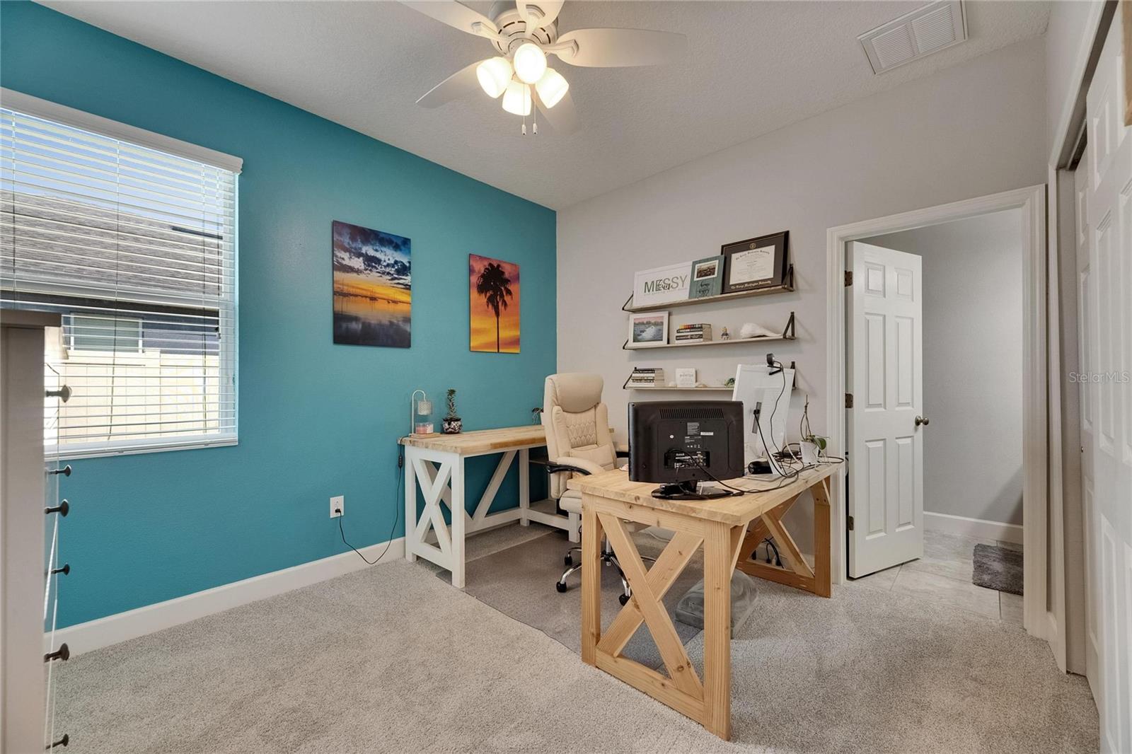 Bedroom is split on its own by the dining area in the front of home