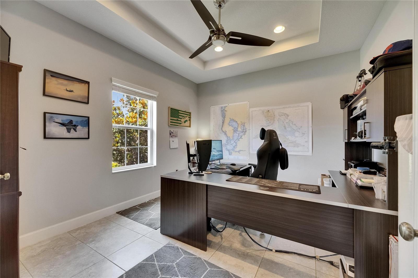 Tray ceielings and fan in office, overlooking front of home