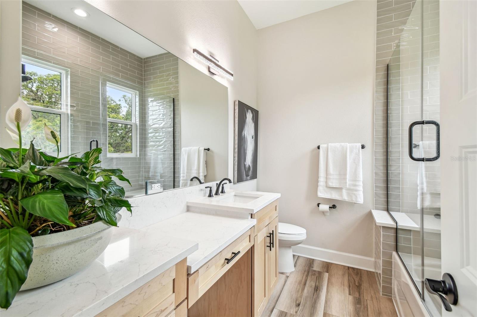 Bedroom 2 ensuite bathroom with shower with tub